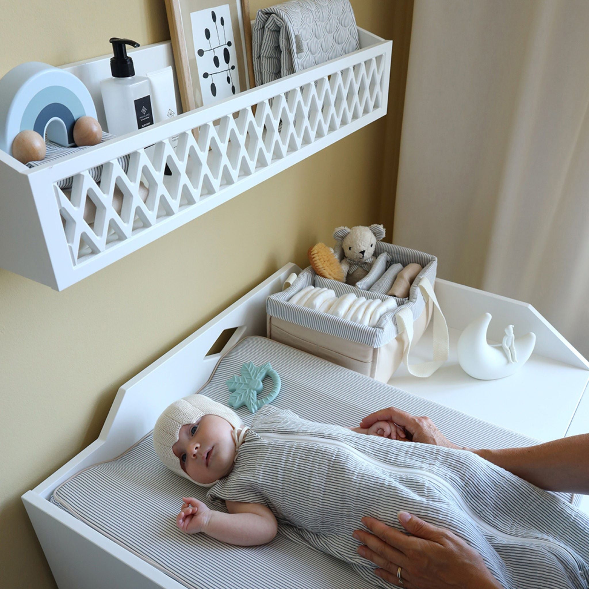 Baby on Changing Table in Blue and White Stripe Sleeping Bag 