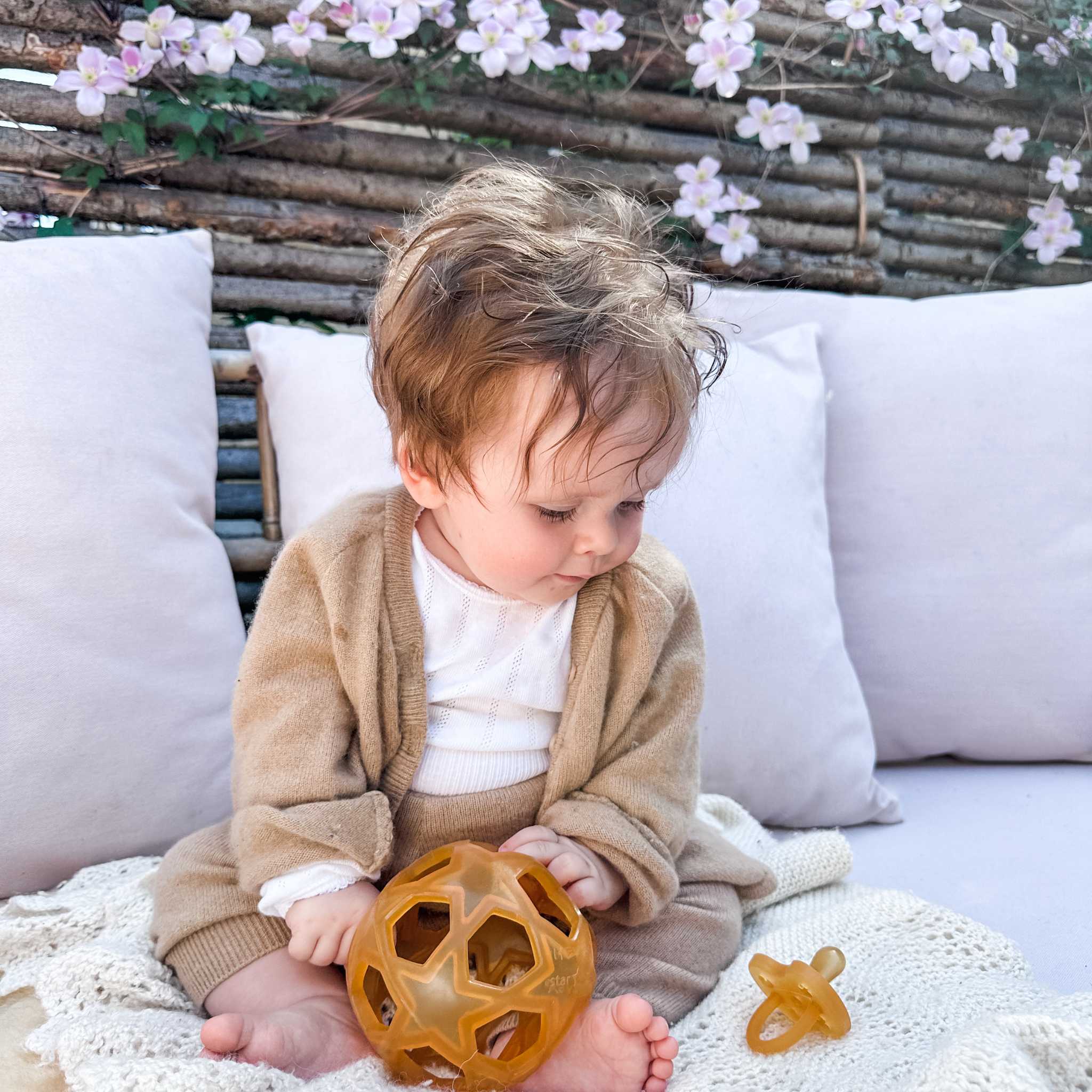 Baby Playing With Hevea Star Activity Ball