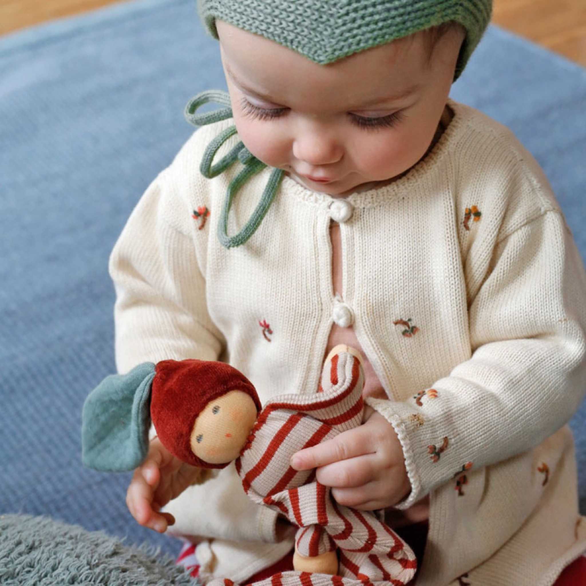 Baby with Nanchen Natur Chestnut Baby Comforter