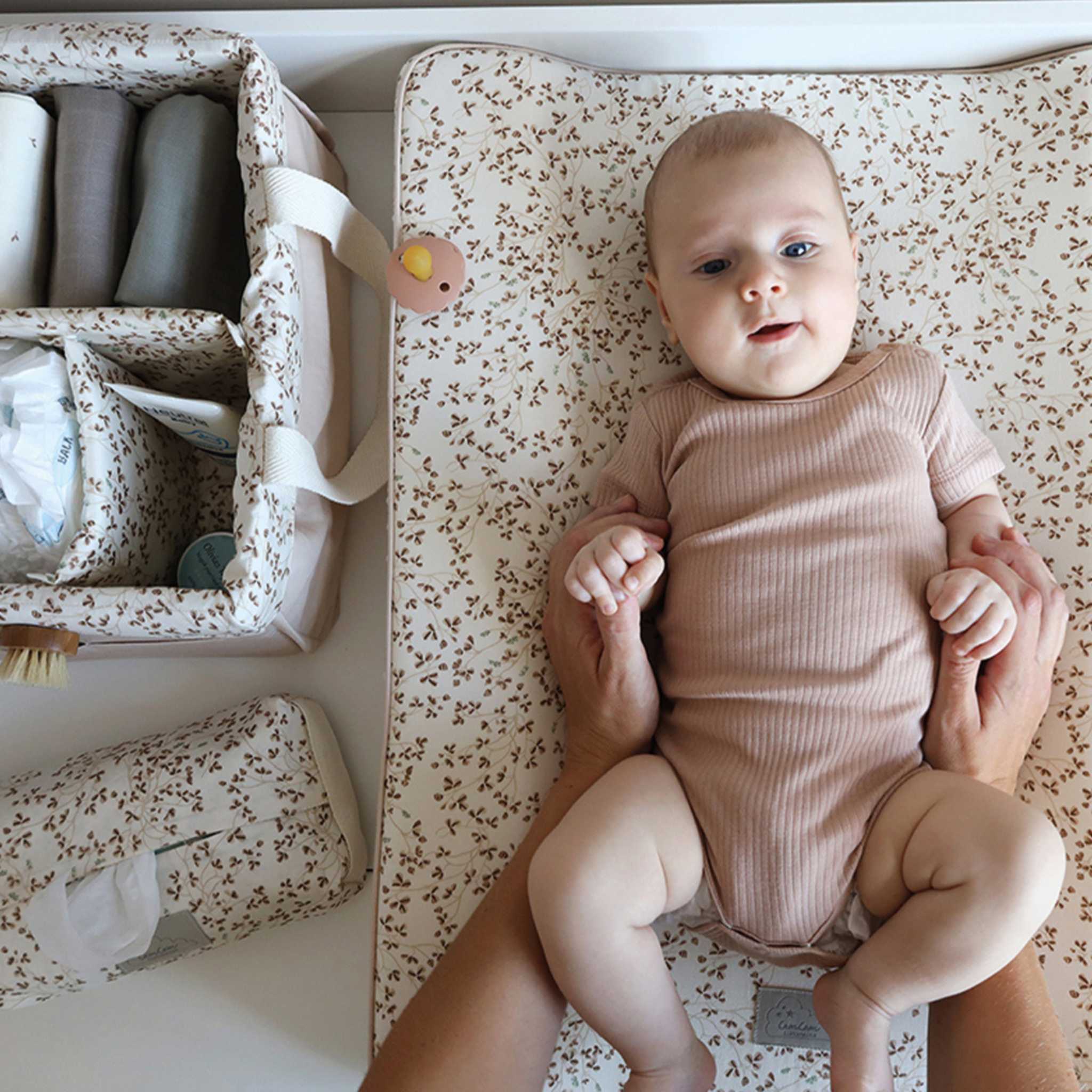 Cam Cam Diaper Caddy Lierre -On Table Next to Changing Baby