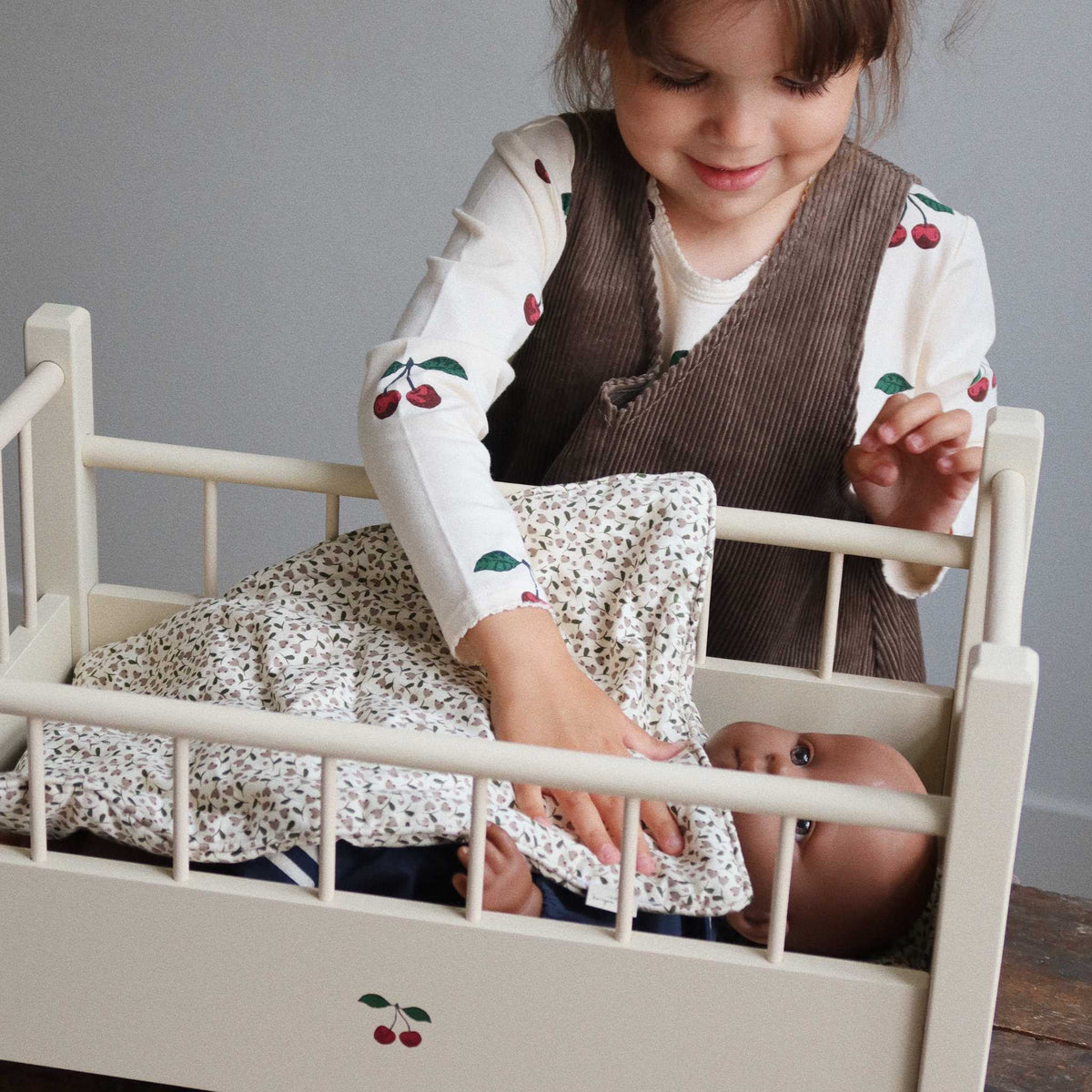 Child Playing With Konges Slojd Milk Tank Bedding