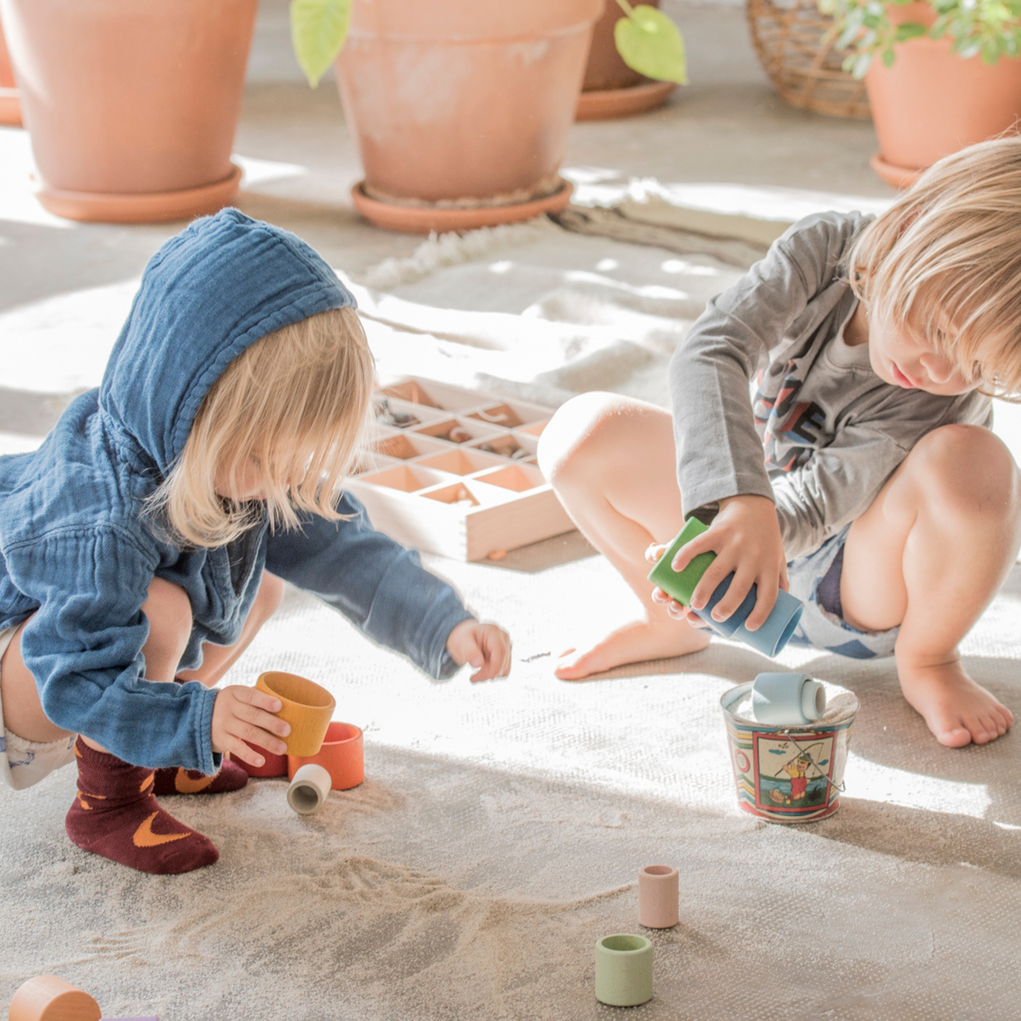 Children Playing With Grapat Nesting Bowls