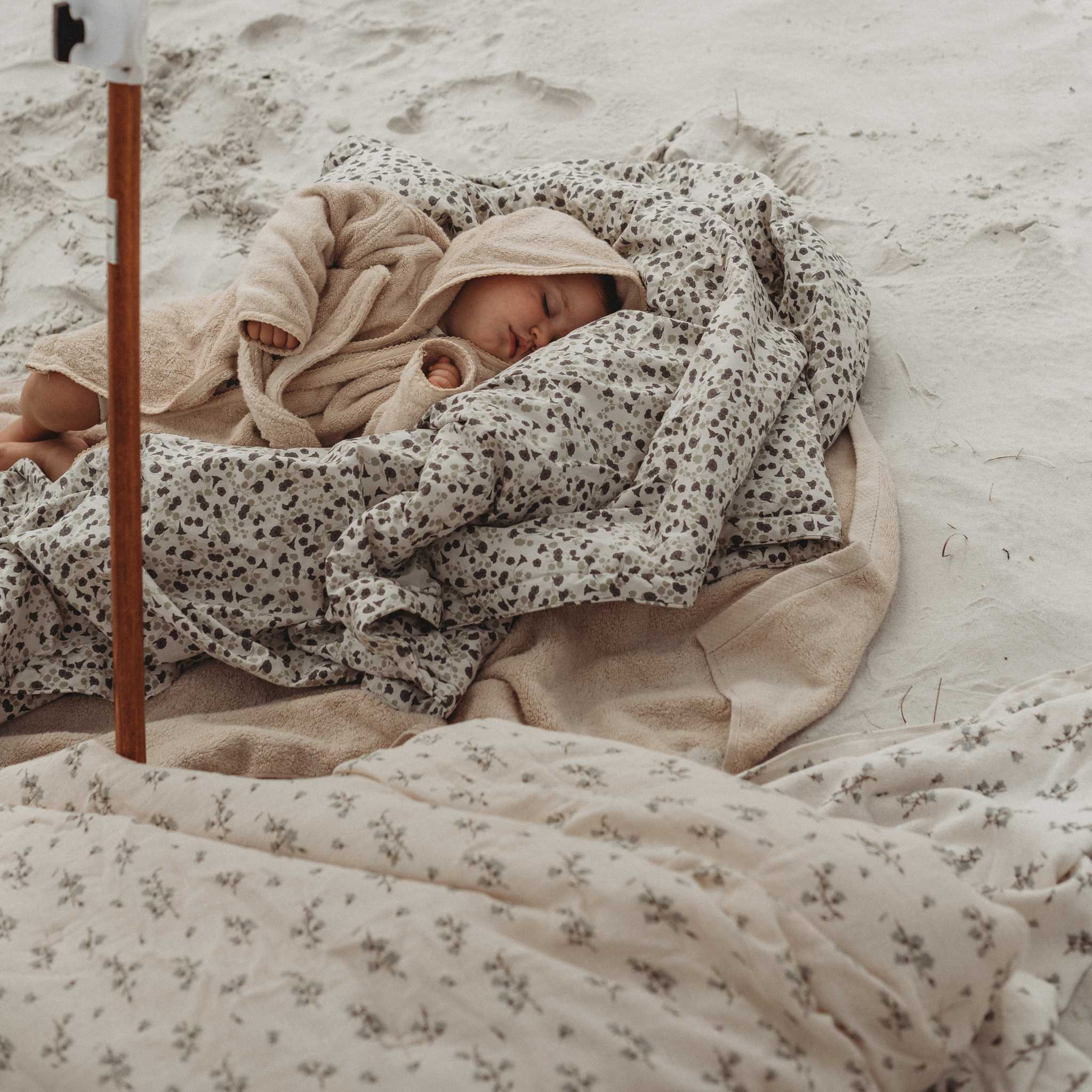 Garbo & Friends Bluebell Filled Blanket - On Beach With Baby