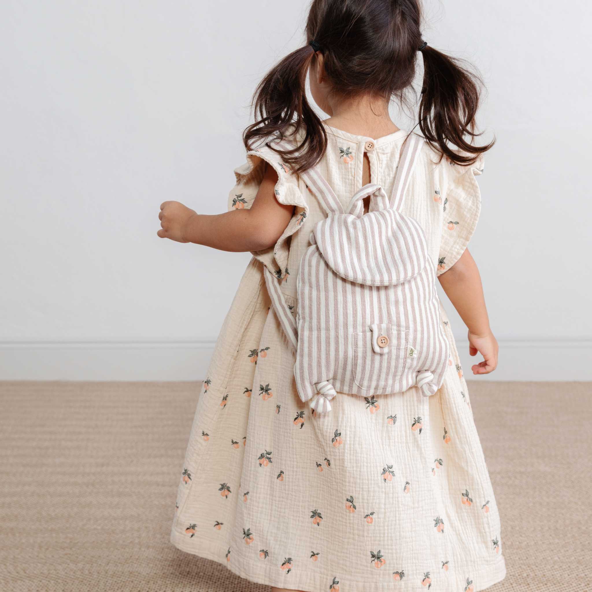 Garbo & Friends Muslin Backpack in Stripe On Girls Back