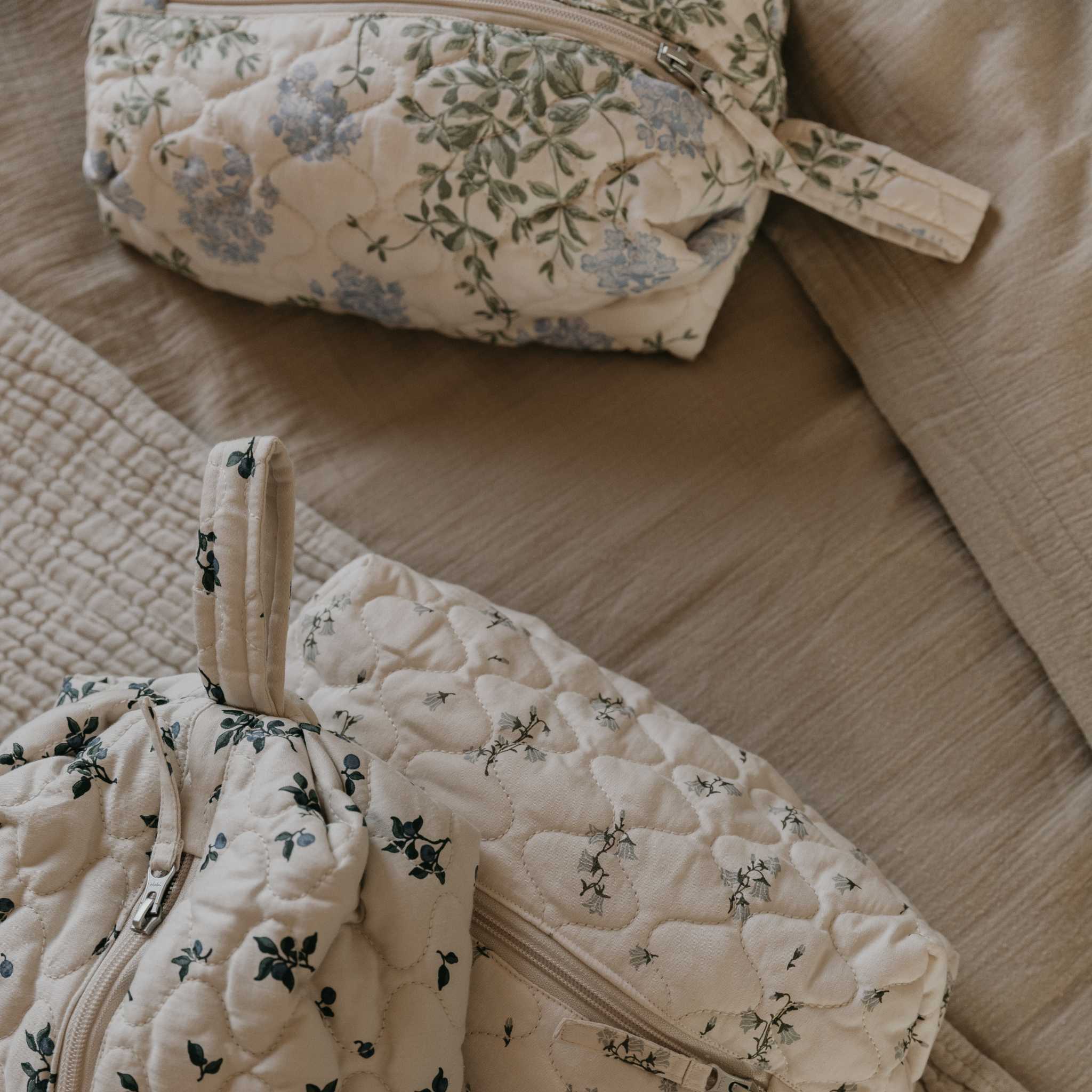 Garbo & Friends Satin Quilted Toiletry Bag - Plumbago - Styled Image