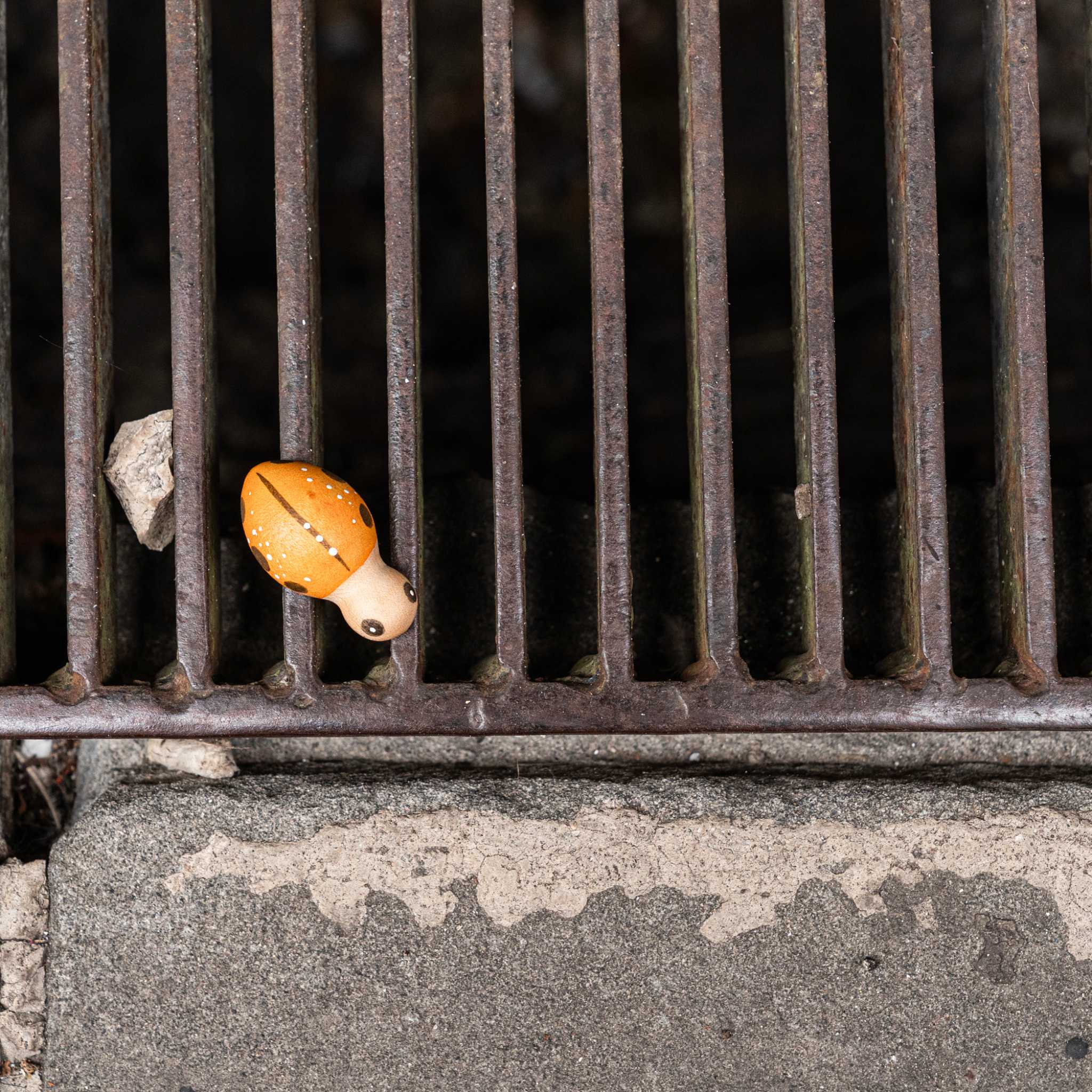 Grapat Lucky Lucky Wooden Animal Figurine On Grate Outside