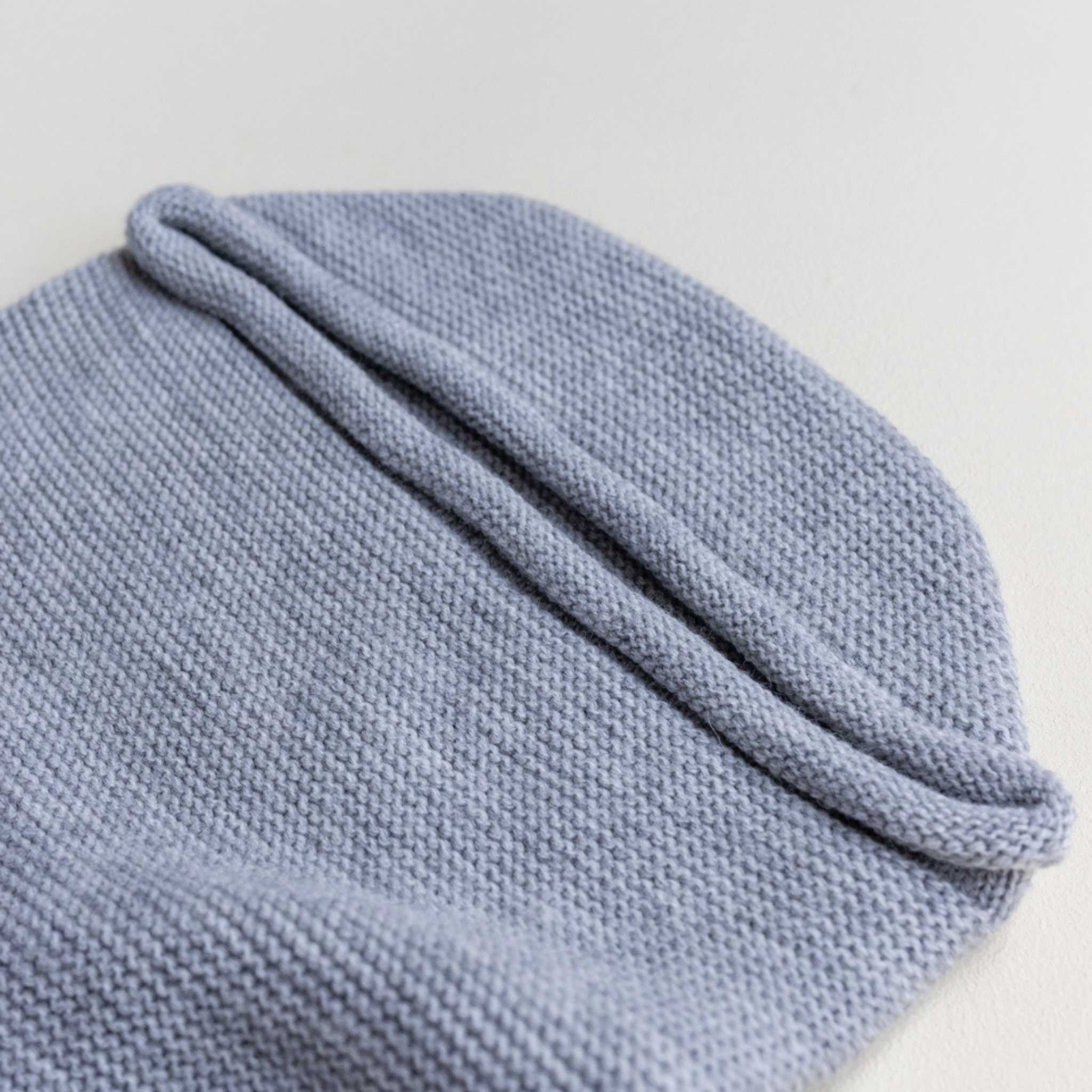 Hvid-Merino-Wool-Cocoon-In-Grey-Hood-Close-Up