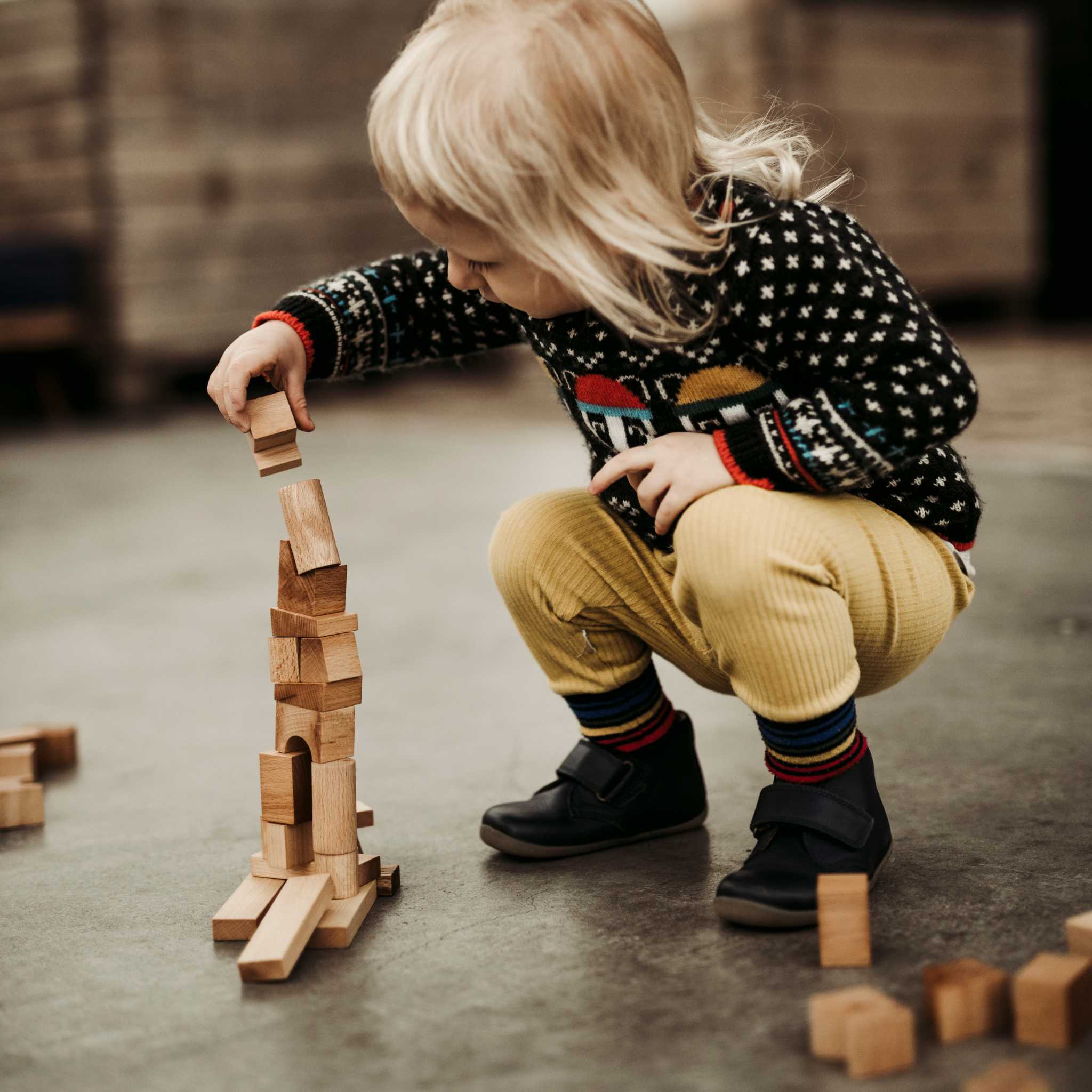 Kid Adding Wooden Story Natural Stacking Tower
