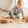 Little Boy Playing With Grapat Nins Rings And Coins