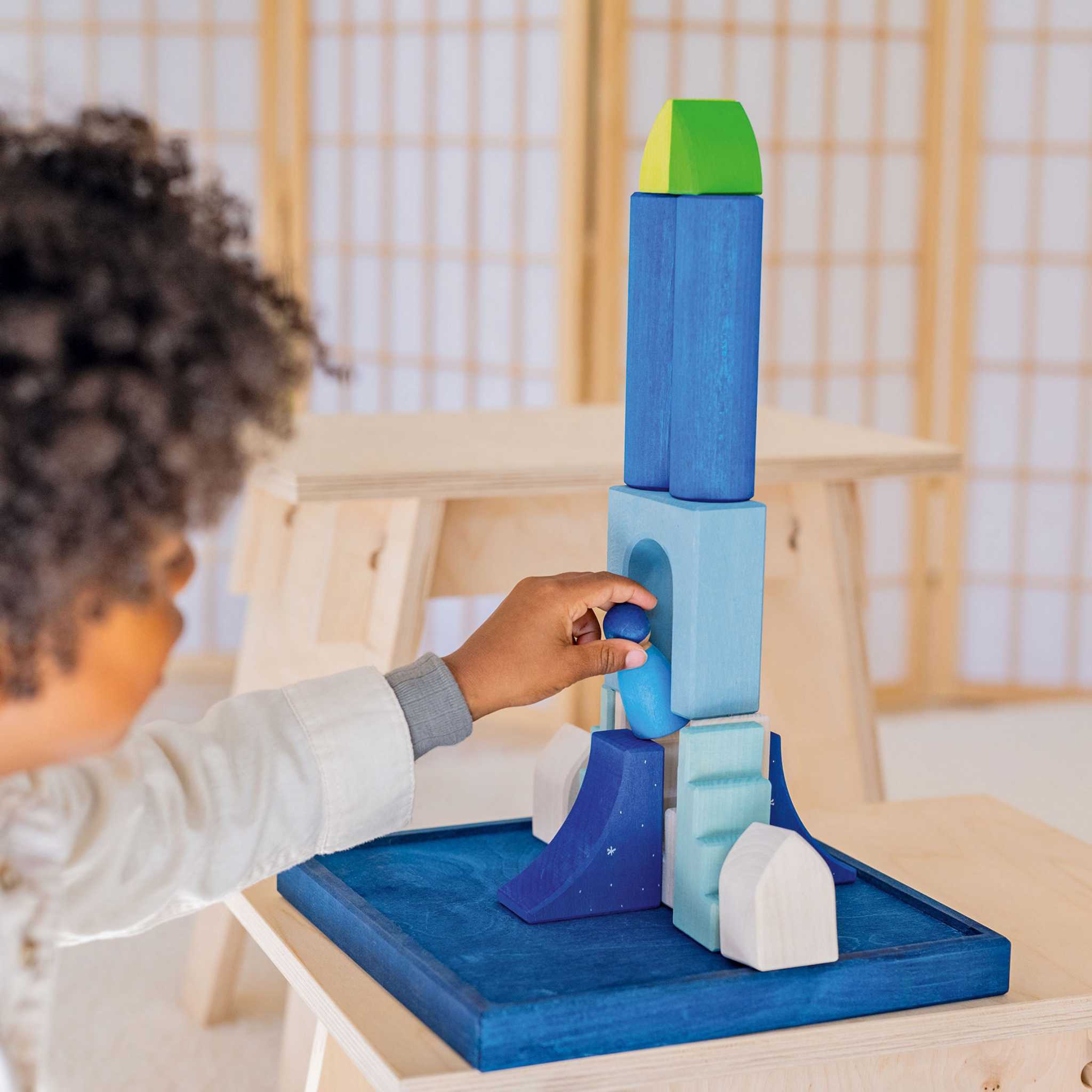 Little Boy With Grimm's Polar Light Play Building World Set