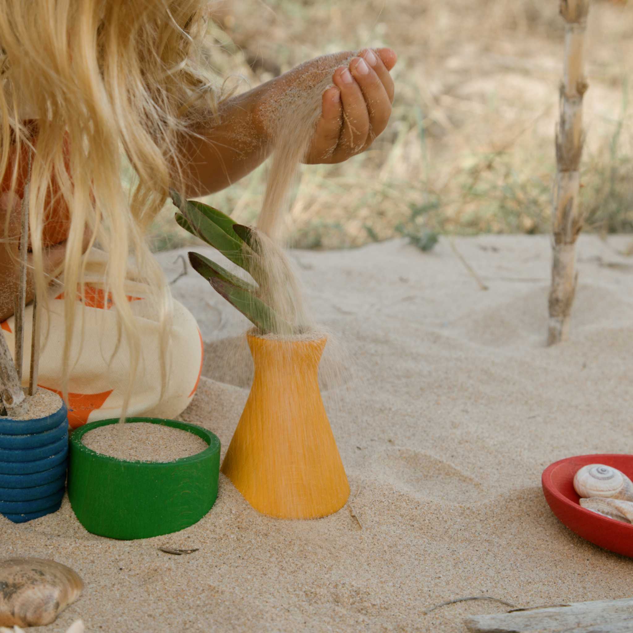 Girl Playing With Yellow Grapat Pot