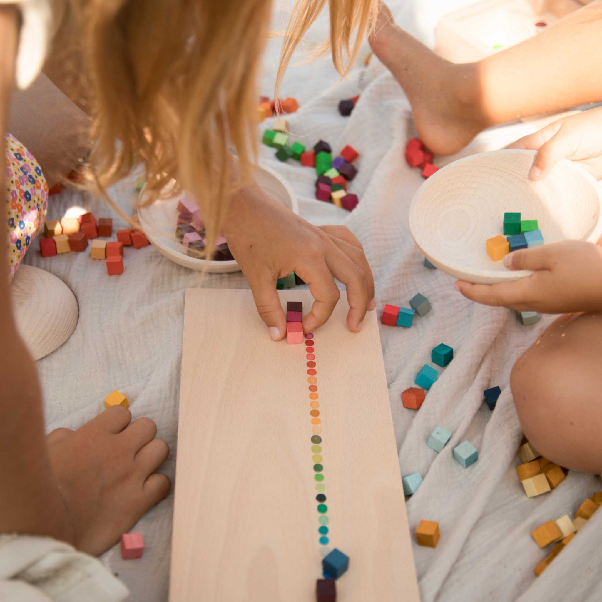 Little Hands Laying Out Grapat Mis And Match Pieces By Colour