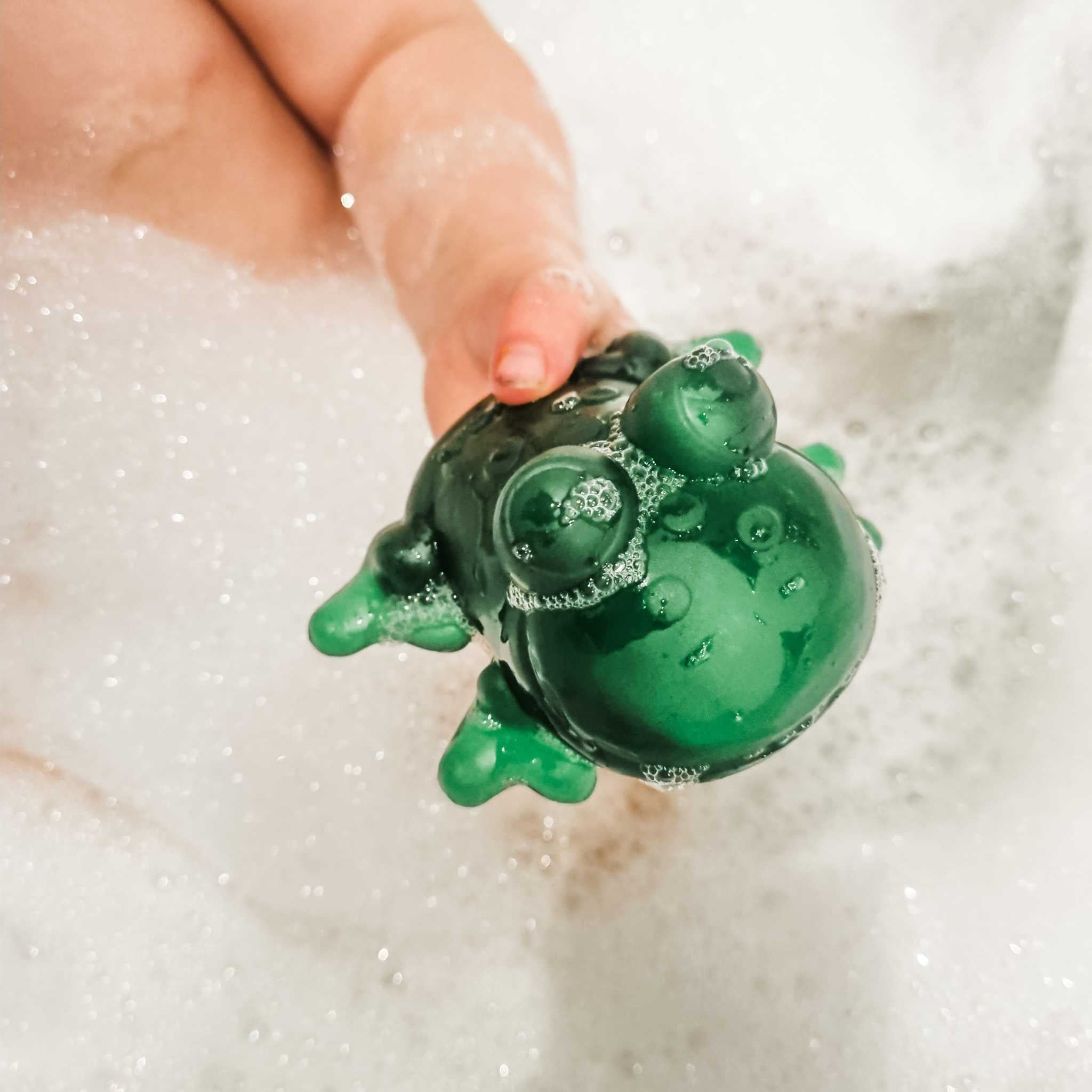 Little One Holding Hevea Fred The Frog