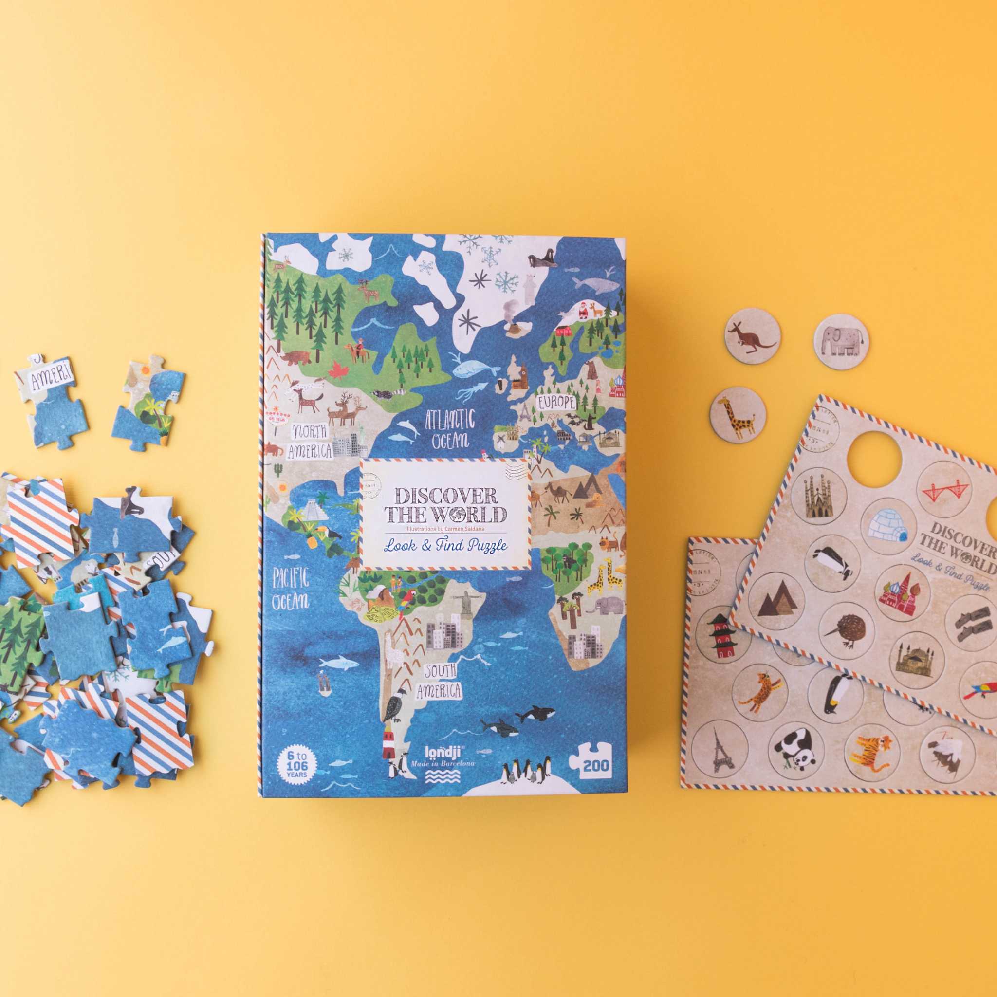 Londji Discover The World Jigsaw Box And Contents On Yellow Background