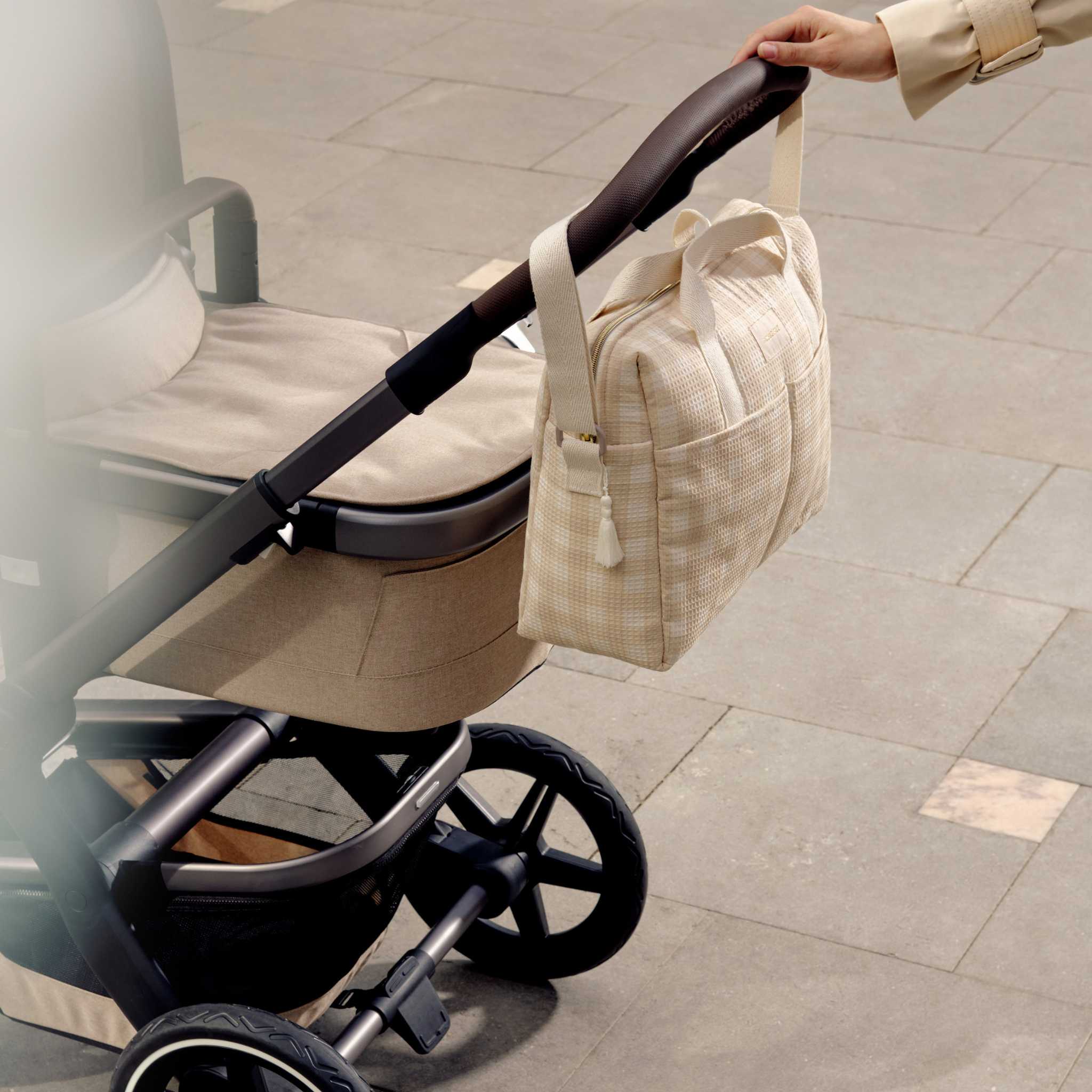 Nobodinoz Gala Changing Bag - Ivory Checks - On Pram Handles