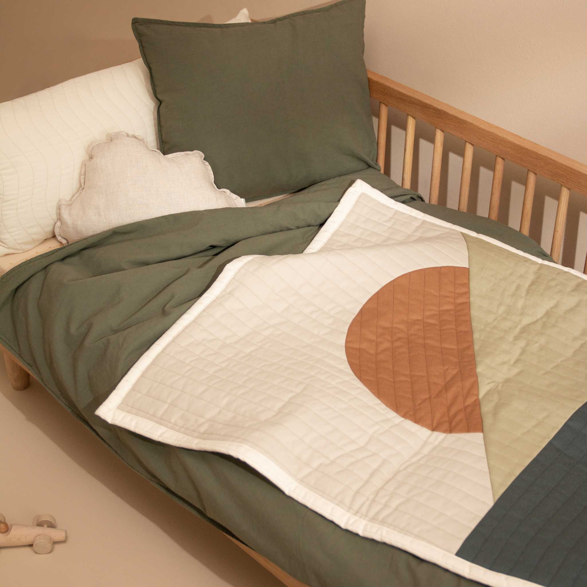 Nododinoz Landscape Quilted Blanket On Bed