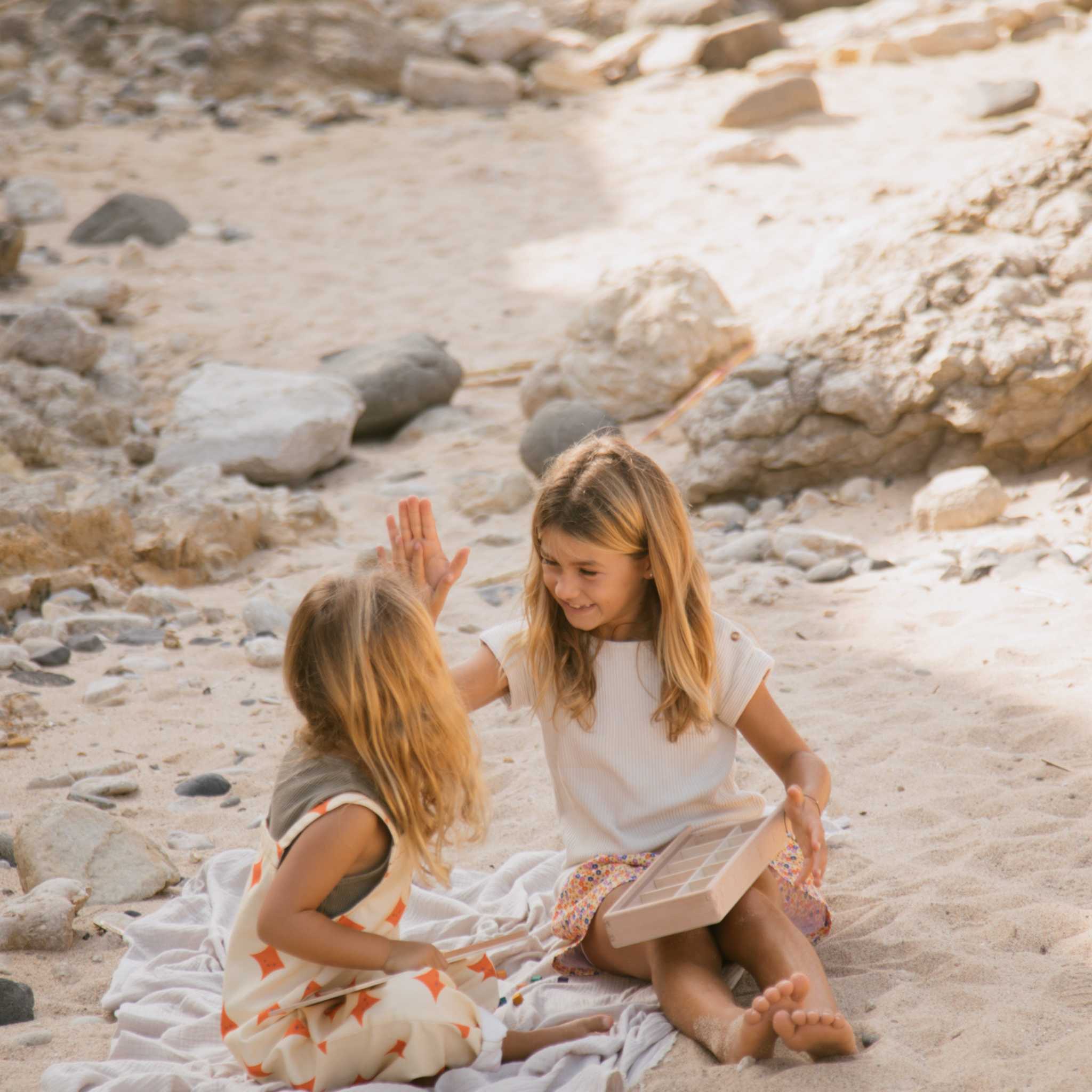 Two Girls Playing With Grapat Mis And Match On Beach