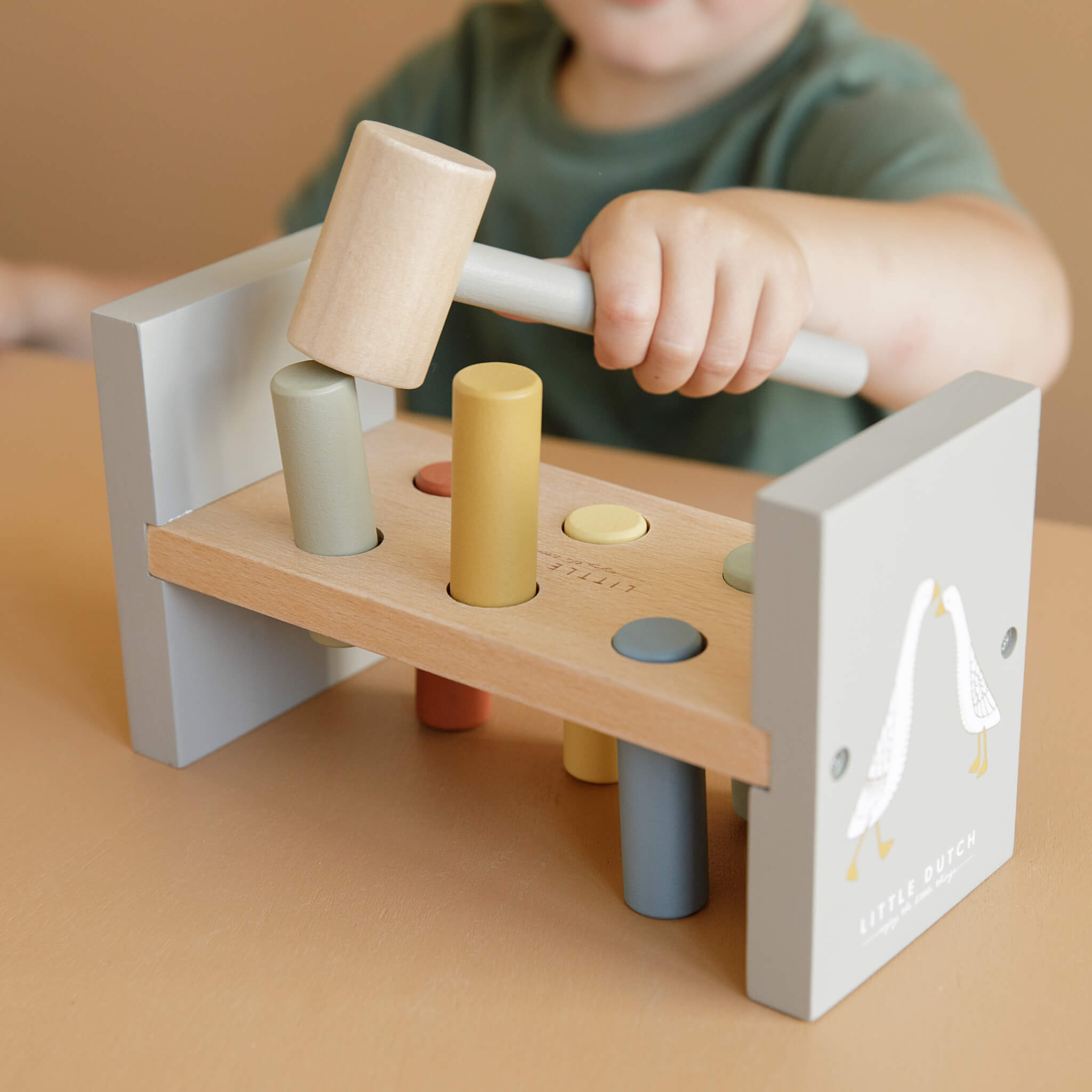 Boy Playing with Little Dutch Hammer Bench in Little Goose