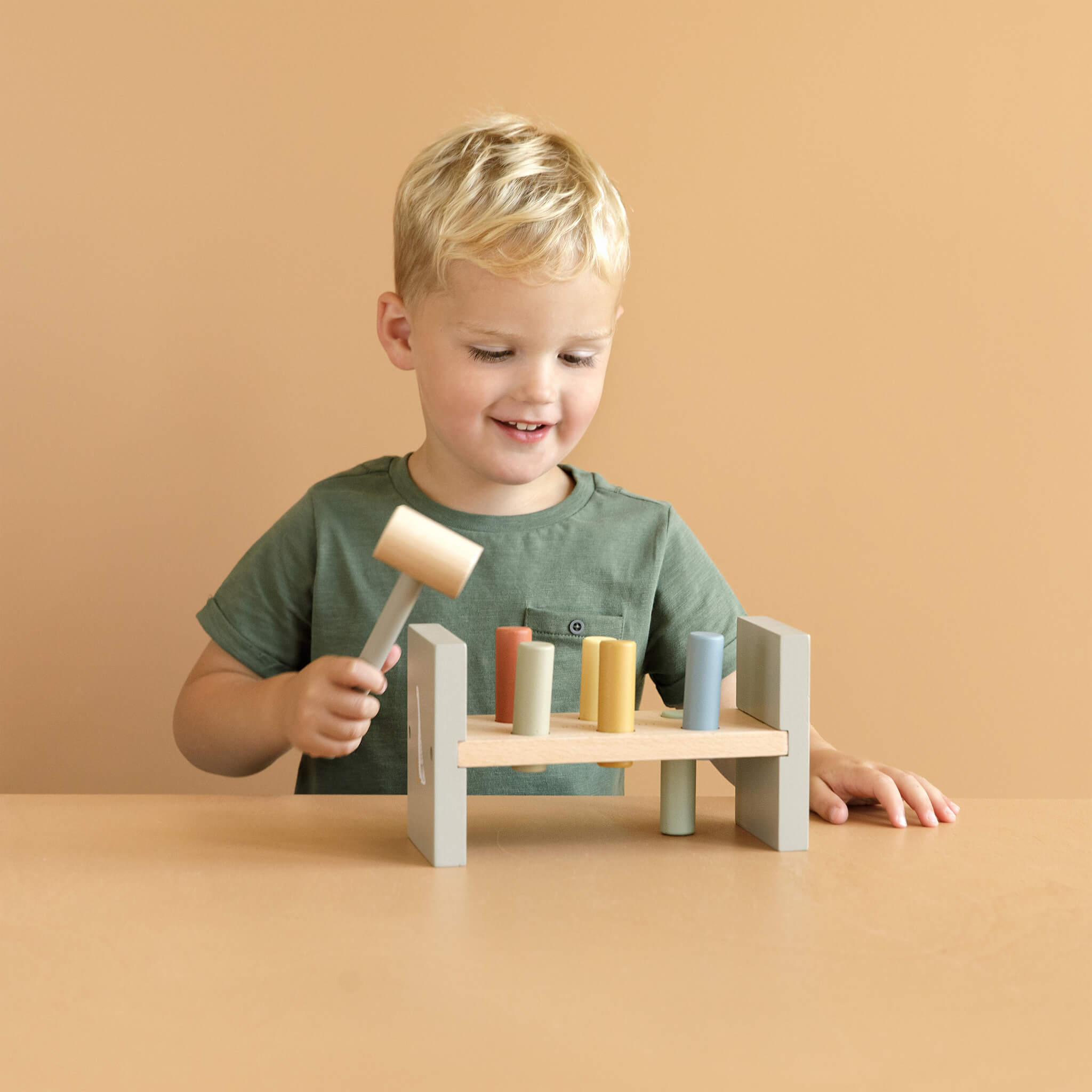 Boy Playing with Little Dutch Hammer Bench in Little Goose