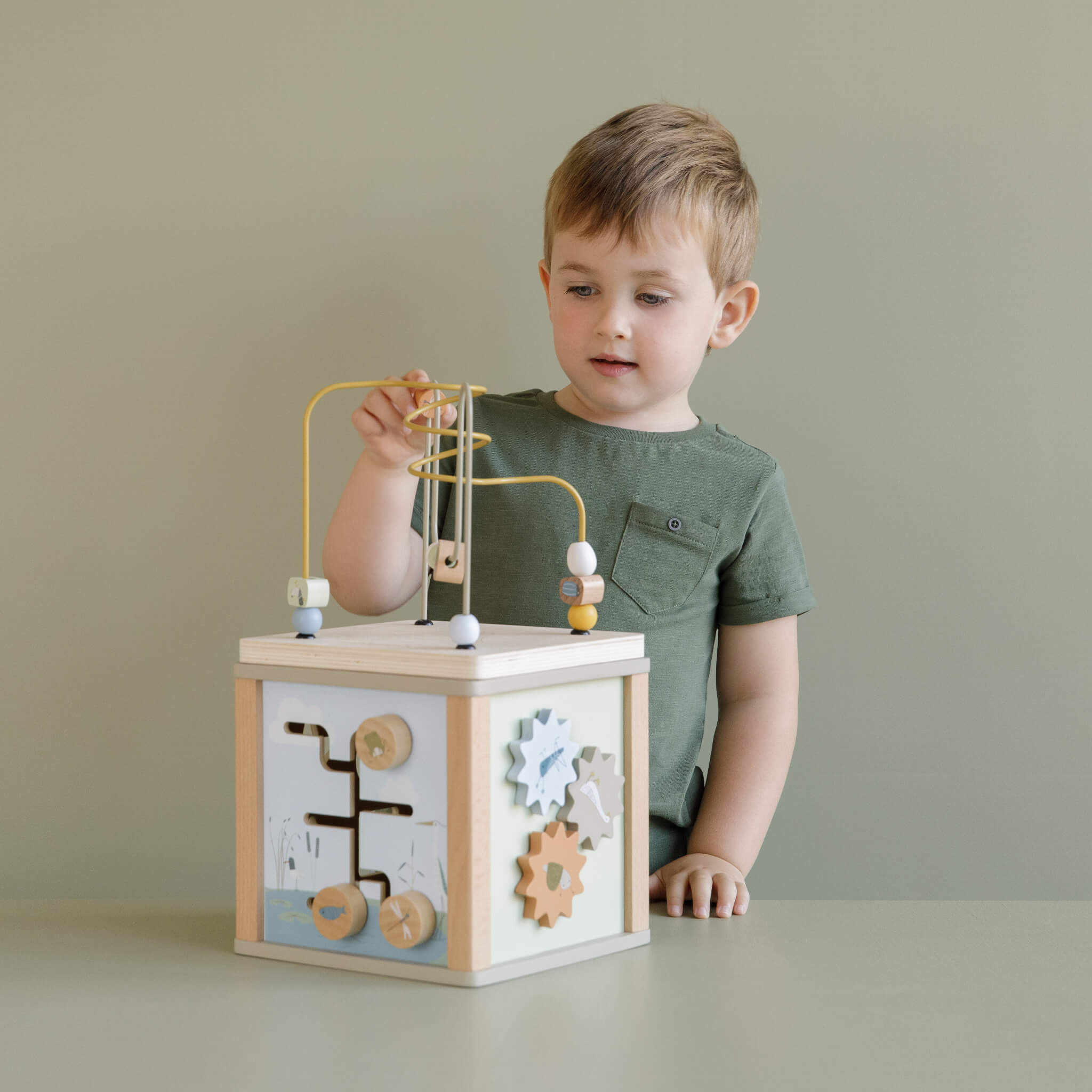 Boy Playing with Little Dutch Wooden Activity Cube Toy in Little Goose Design