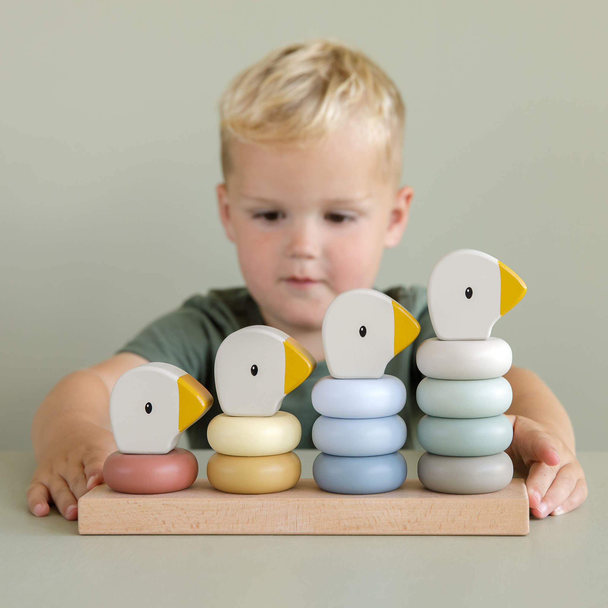 Boy Playing with Little Dutch Goose Stacking Family