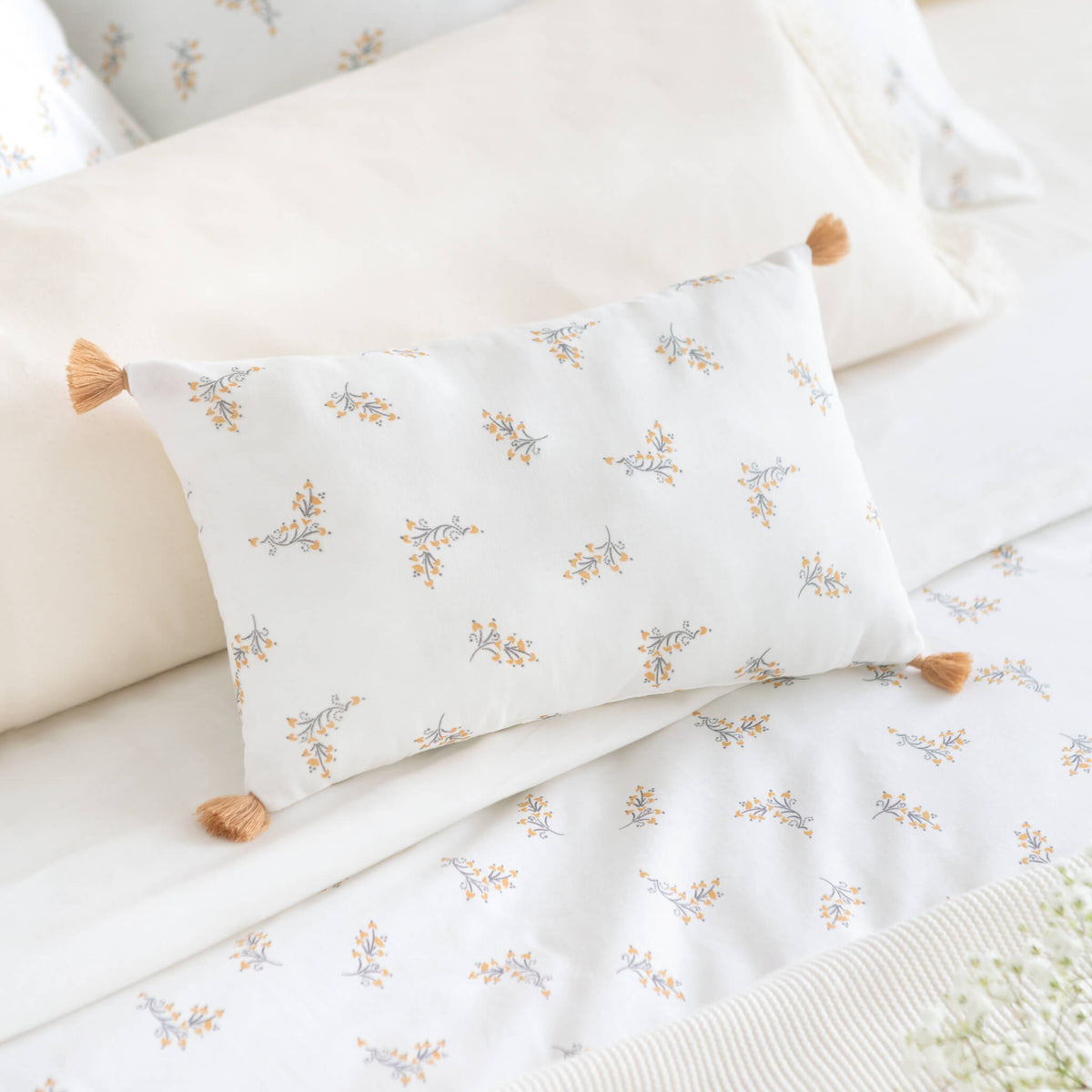 Nobodinoz Sublim Cushion in Flore on Bed