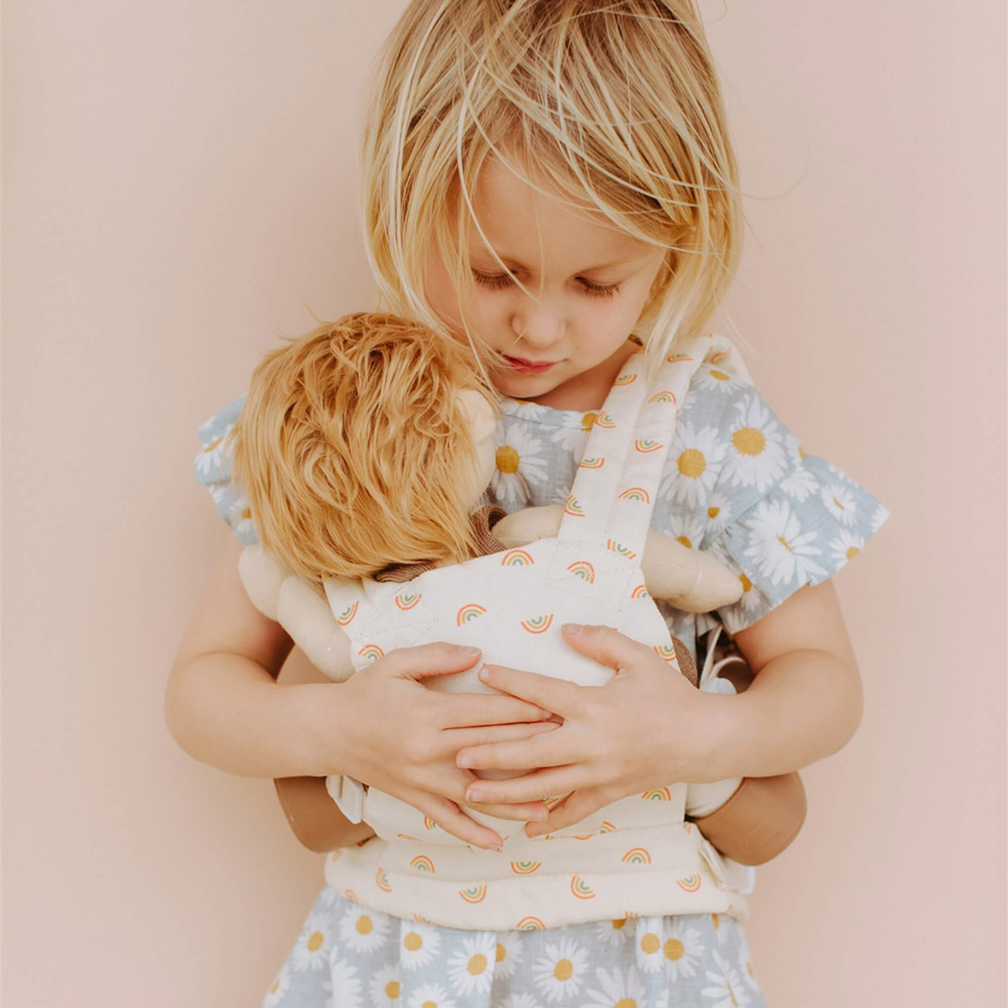 Olli Ella Rainbow Carrier for Dolls on Girl