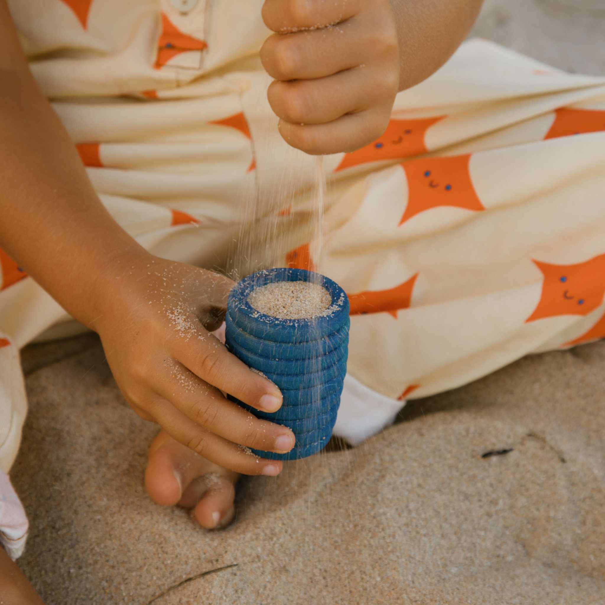 Boy Playing with Blue Grapat Pot