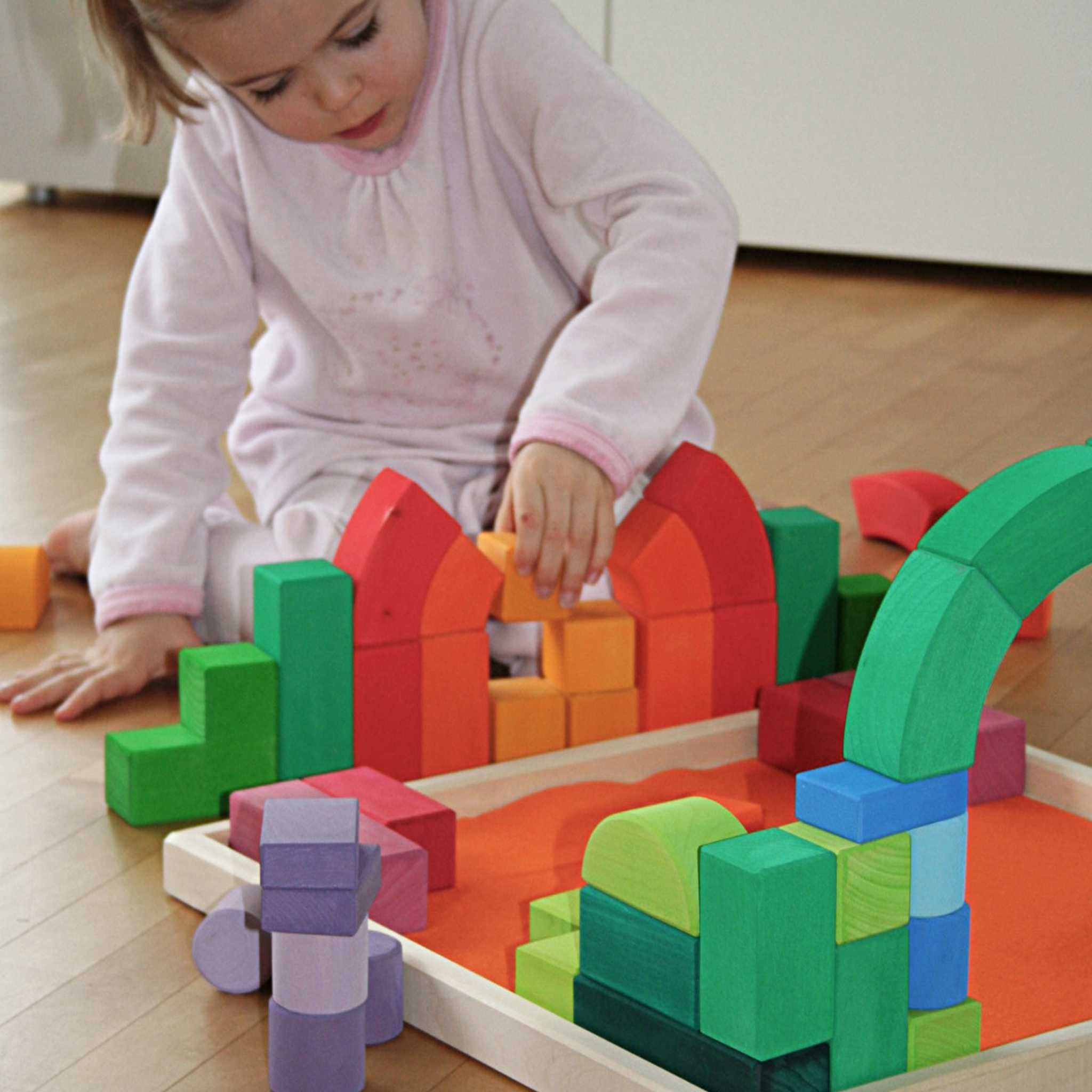 Child Playing With Grimm's Romanesque Building Set