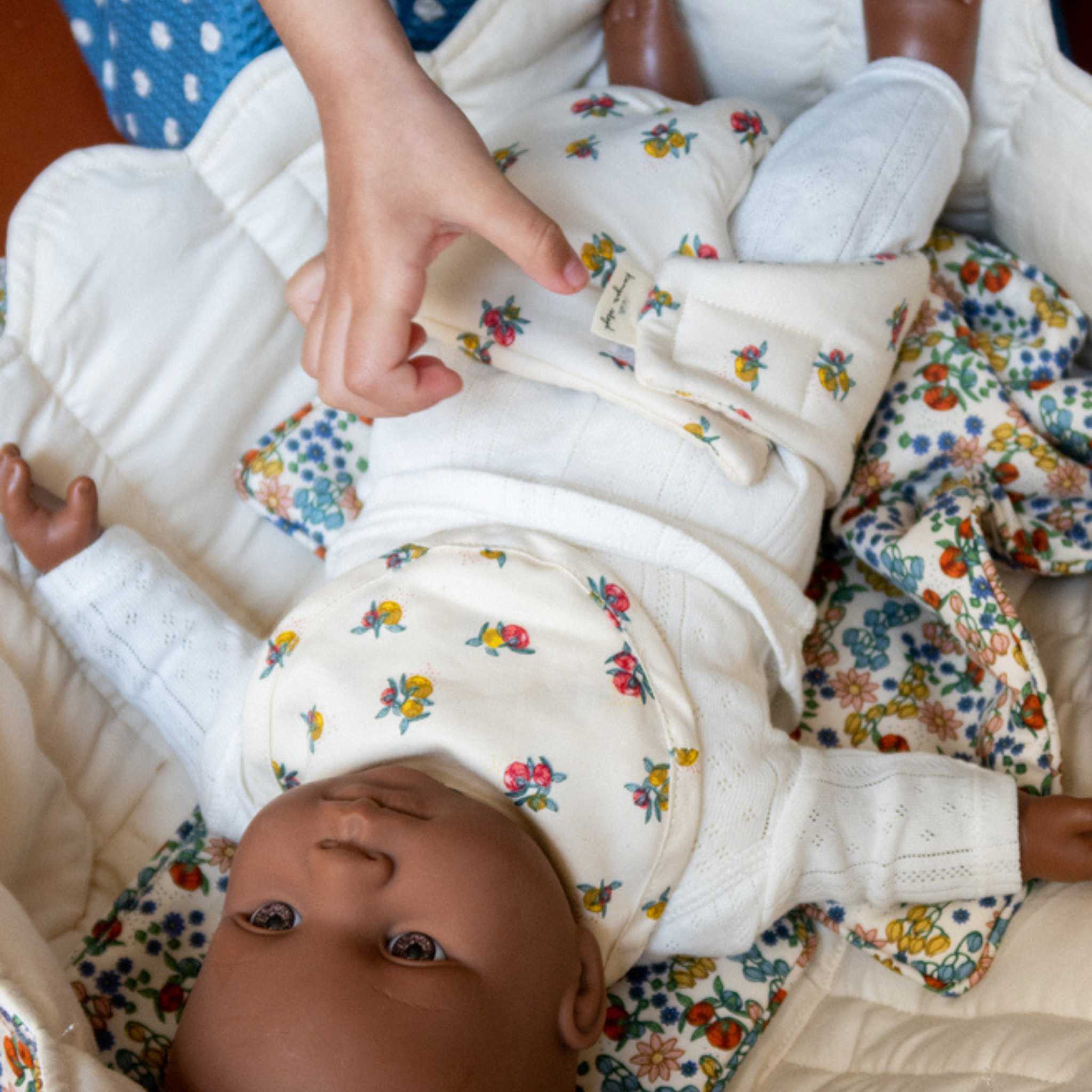 Child Playing With Konges Slojd Dolls Bedding In Bibi Fleur