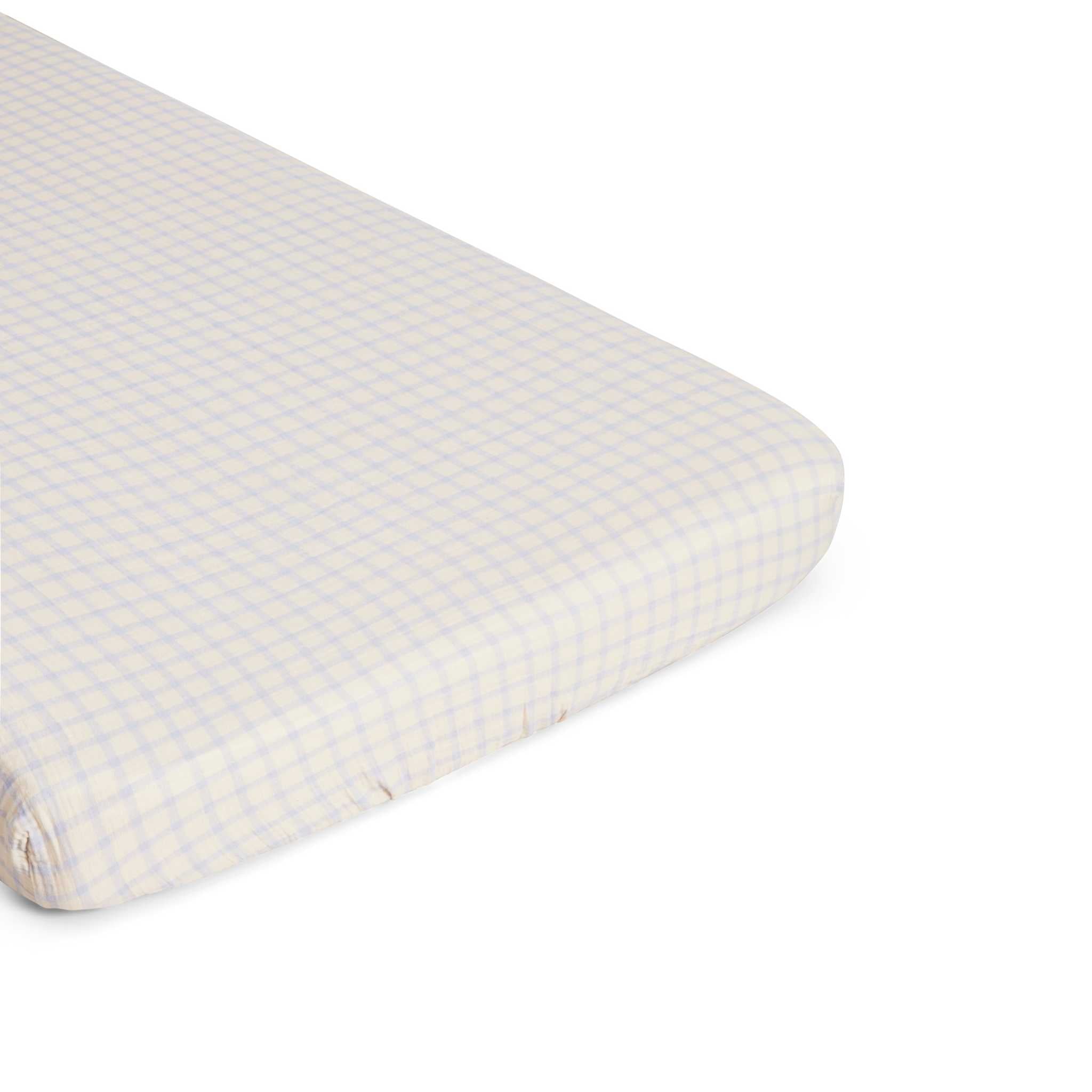 Garbo & Friends Sky Blue Muslin Cot Sheet - Up Close On Mattress