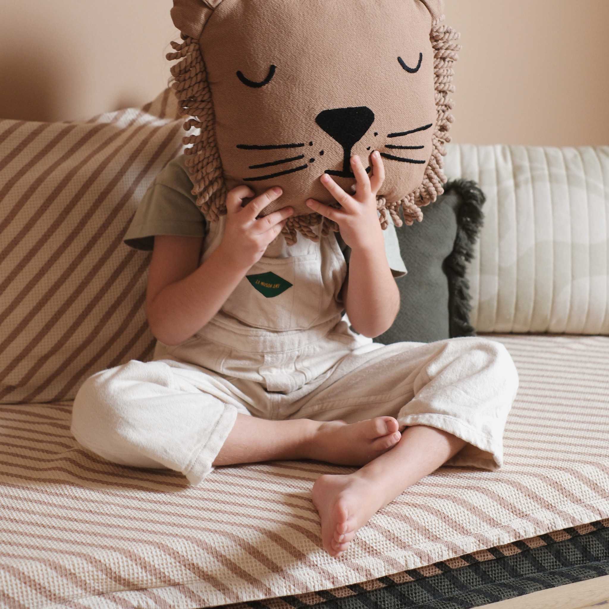 Girl On Nobodinoz Landscape Waffle Floor Mattress With Lion Cushion