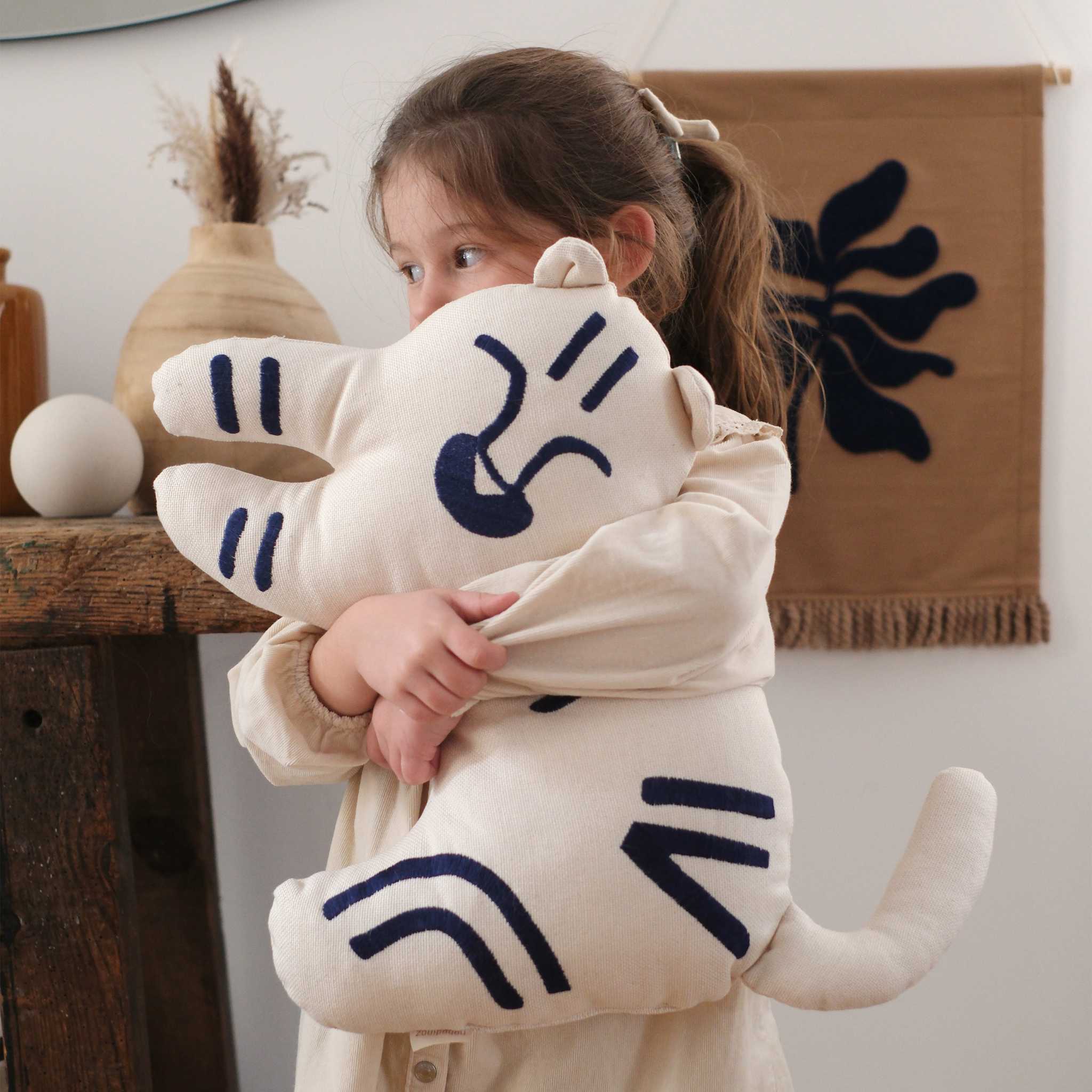 Girl with Nobodinoz Tiger Embroidered Cushion