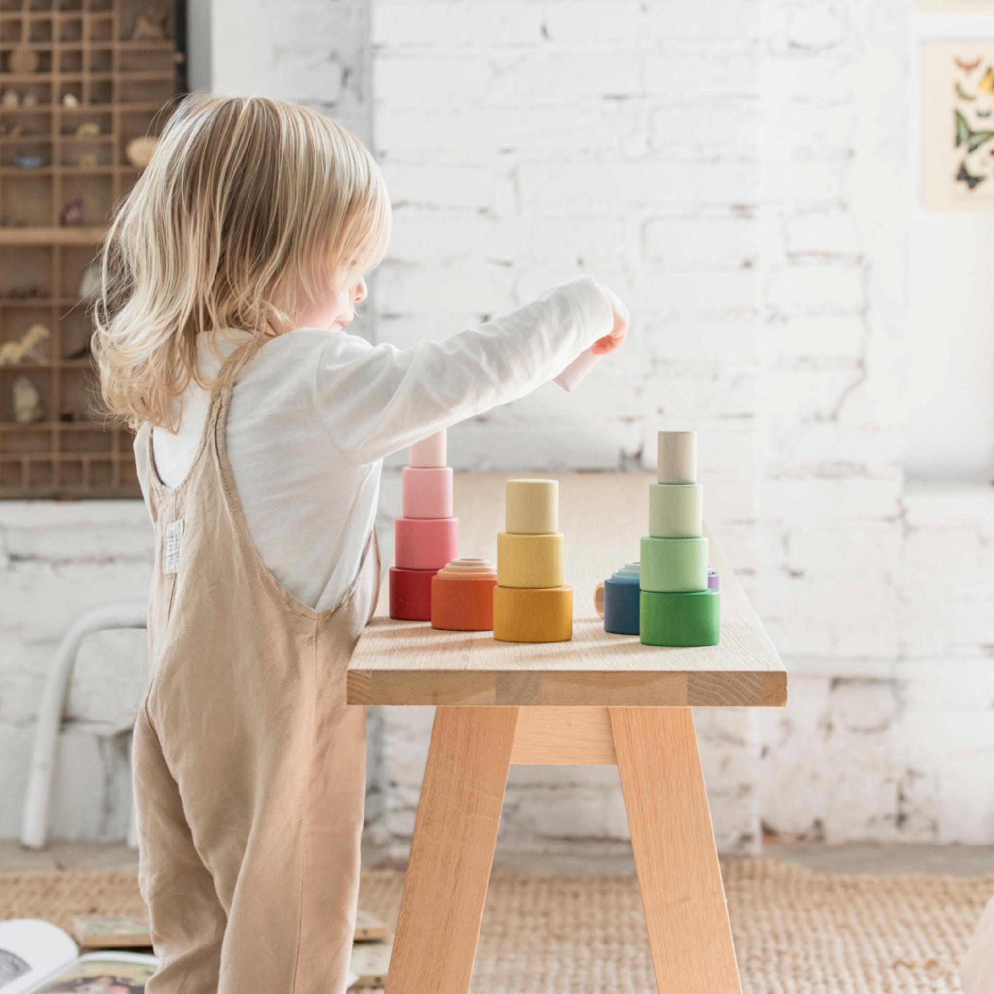 Girl Stacking Grapat Nesting Bowls