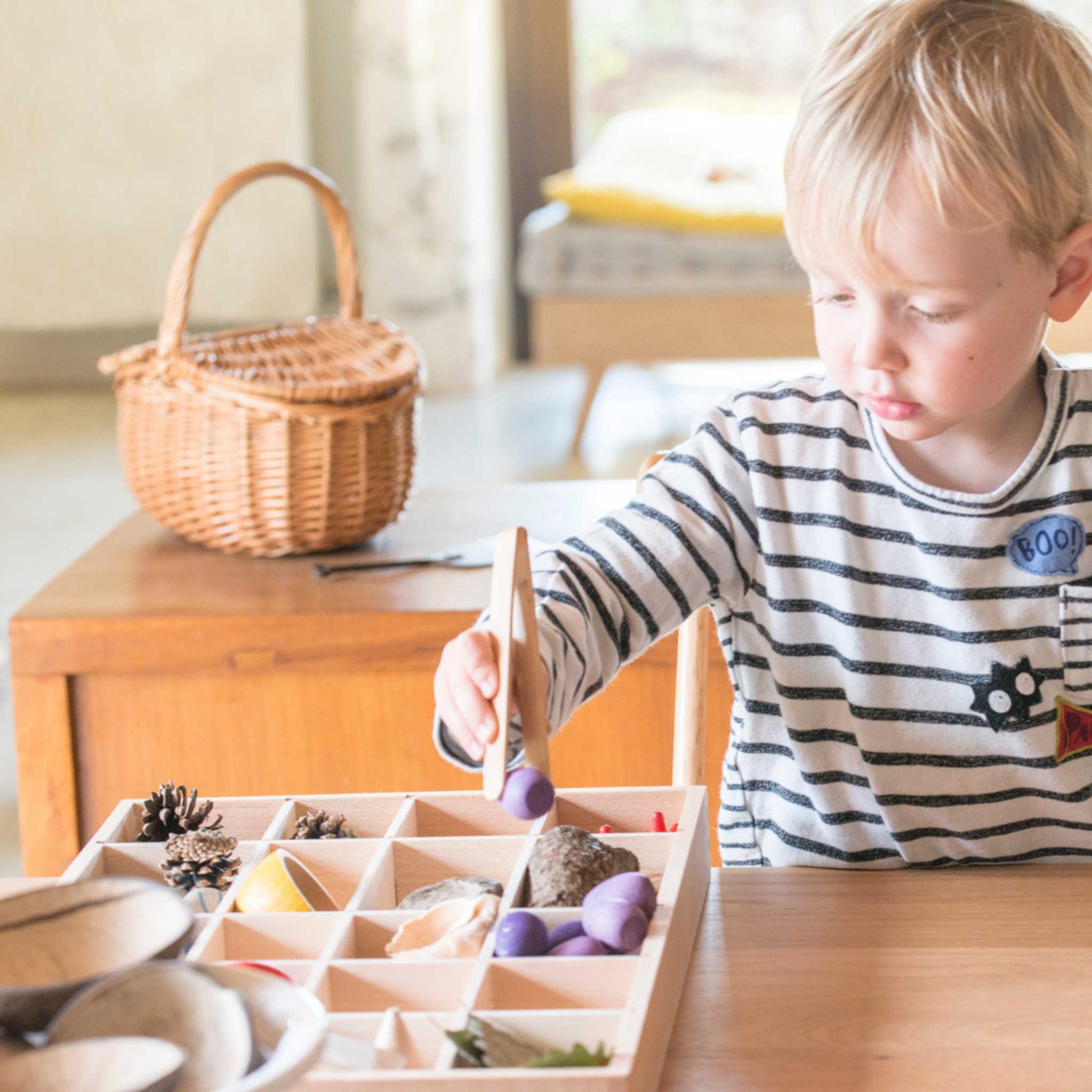 Boy Playing with Grapat Tinker Tray