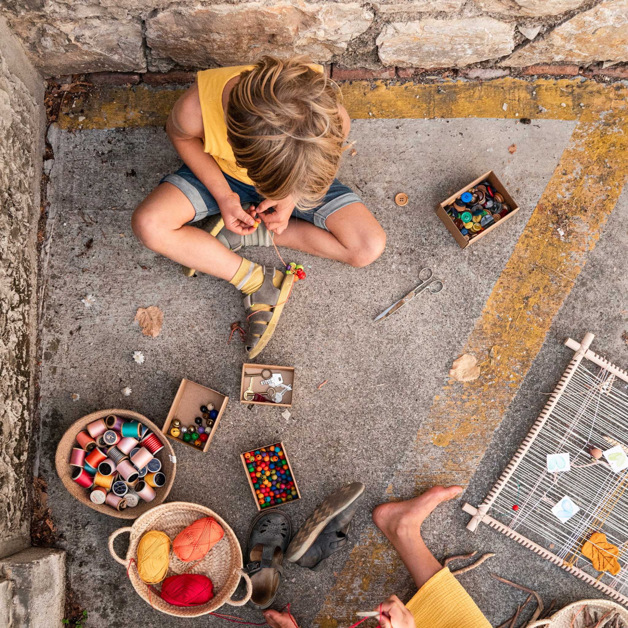 Boy With Grapat Weaving Frame