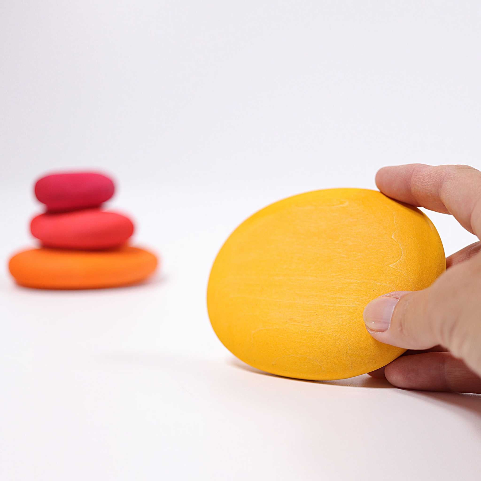 Grimm's Fire Pebbles Shown With Hand