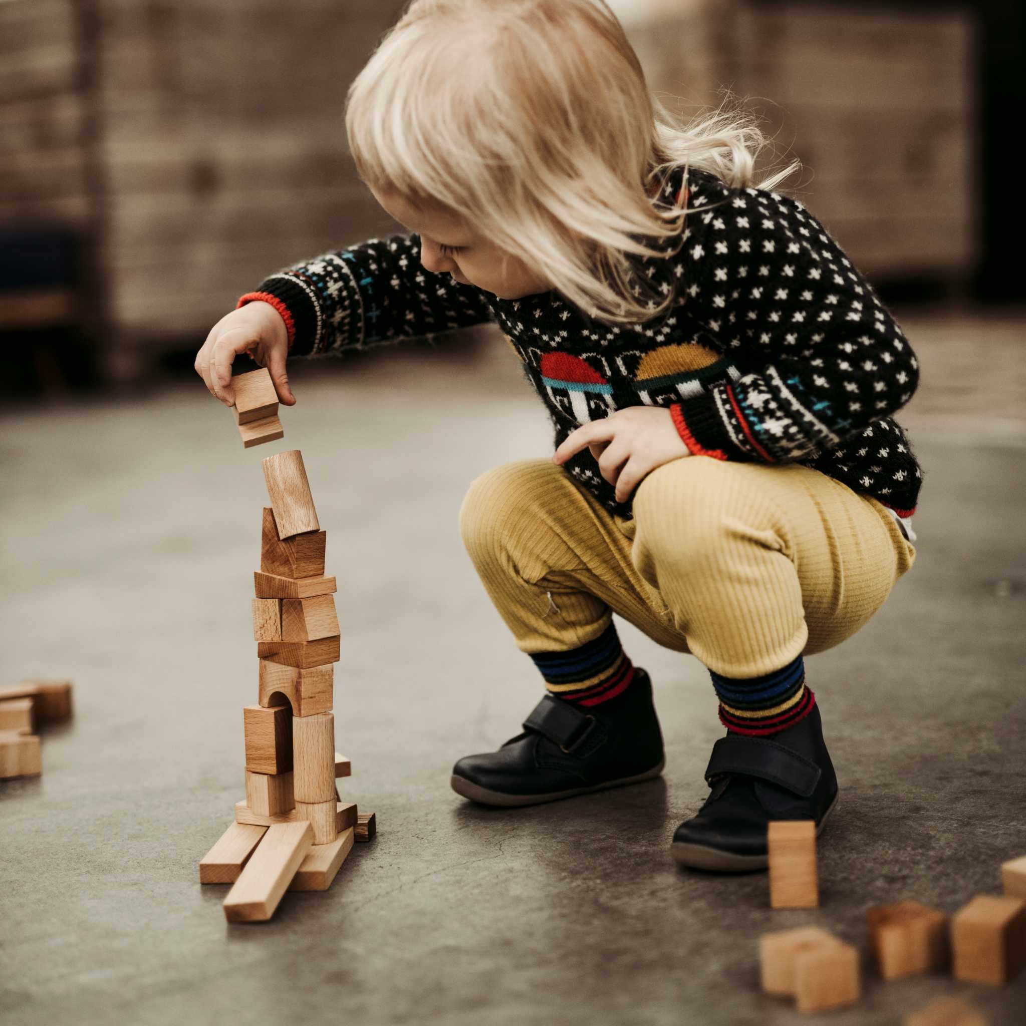 Kid Adding Wooden Story Natural Stacking Tower 