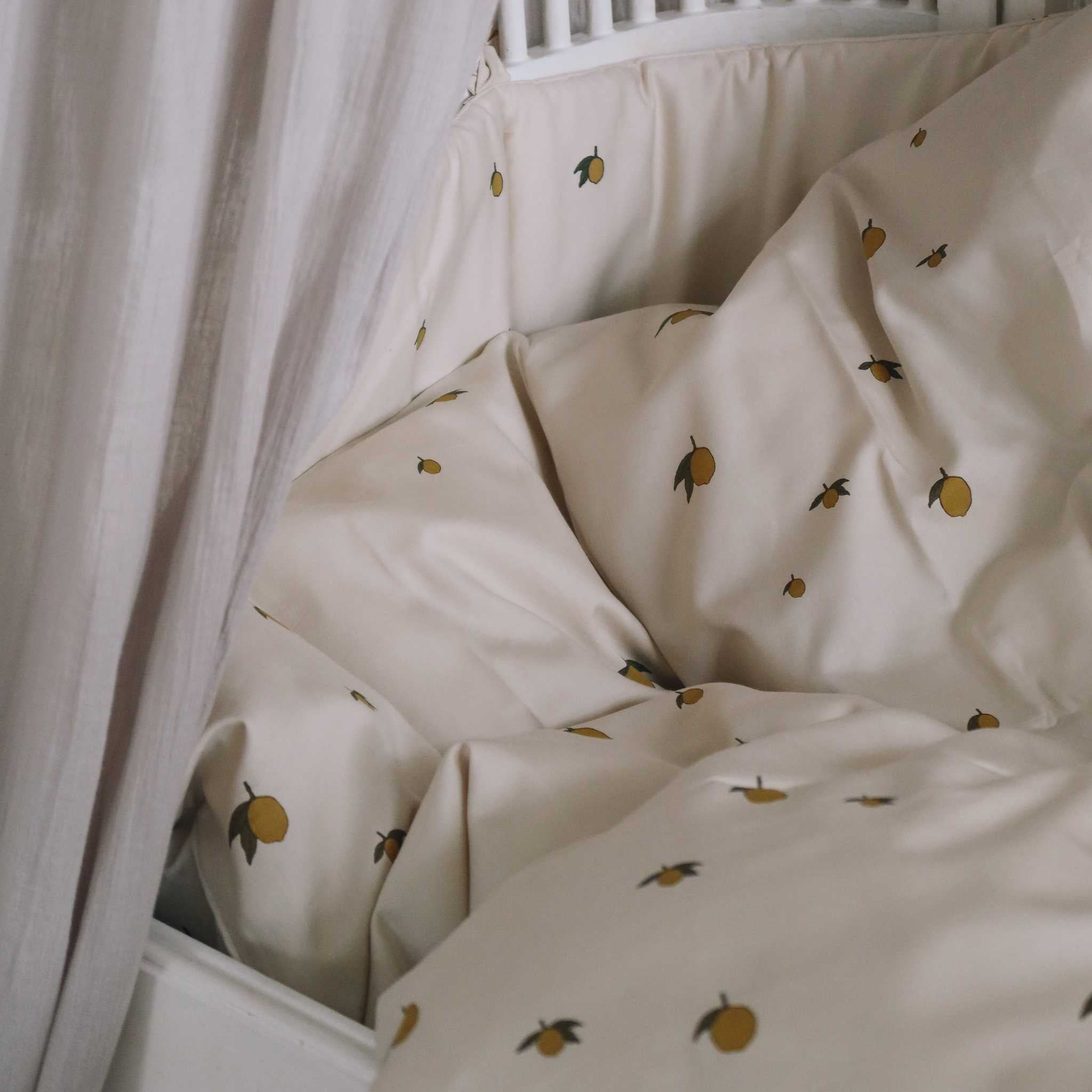 Konges-Slojd-Lemon-Toddler-Bedding-Set-Lifestyle Image In Cot