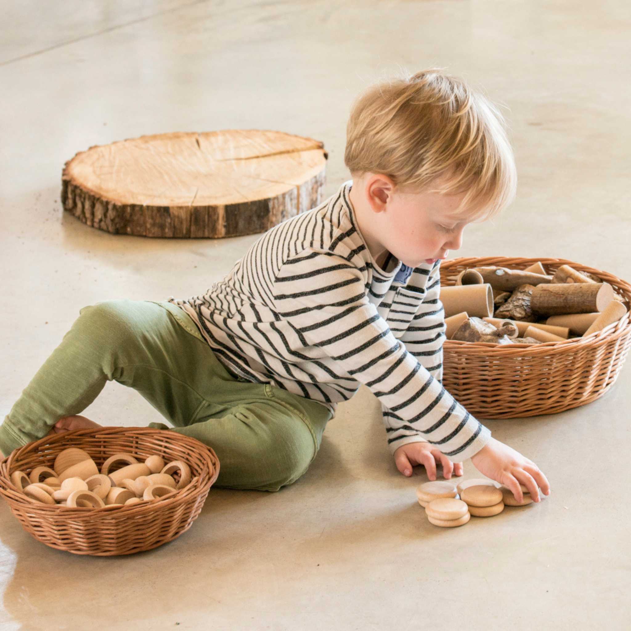 Little Boy Playing With Grapat Nins Rings And Coins 