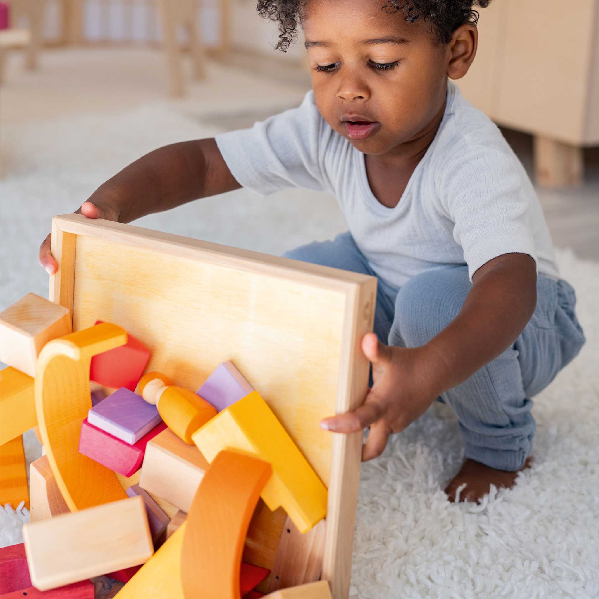 Little Boy With Grimm's Building World - Dessert Sands 