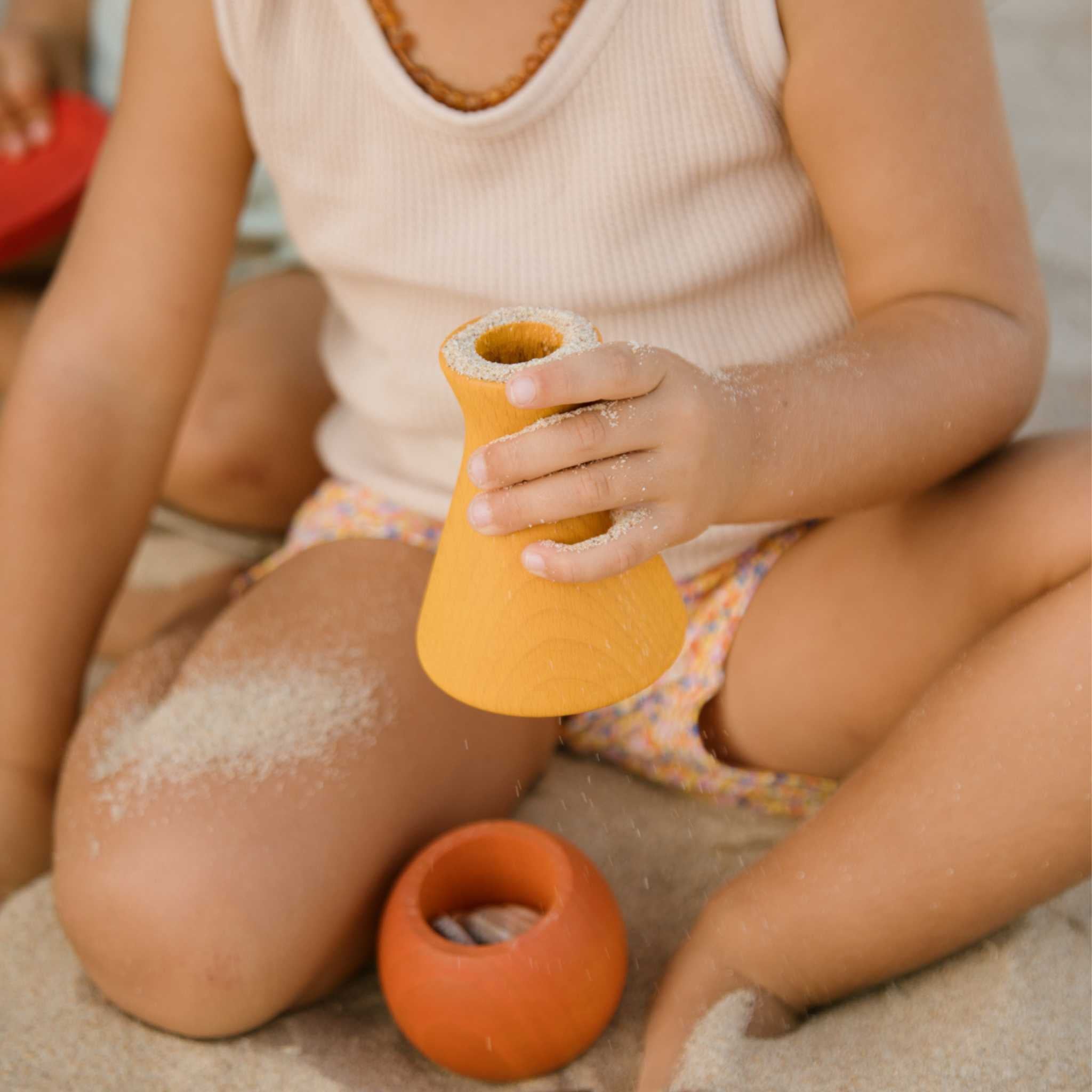 Little Hands Playing With Grapat Yellow Pot