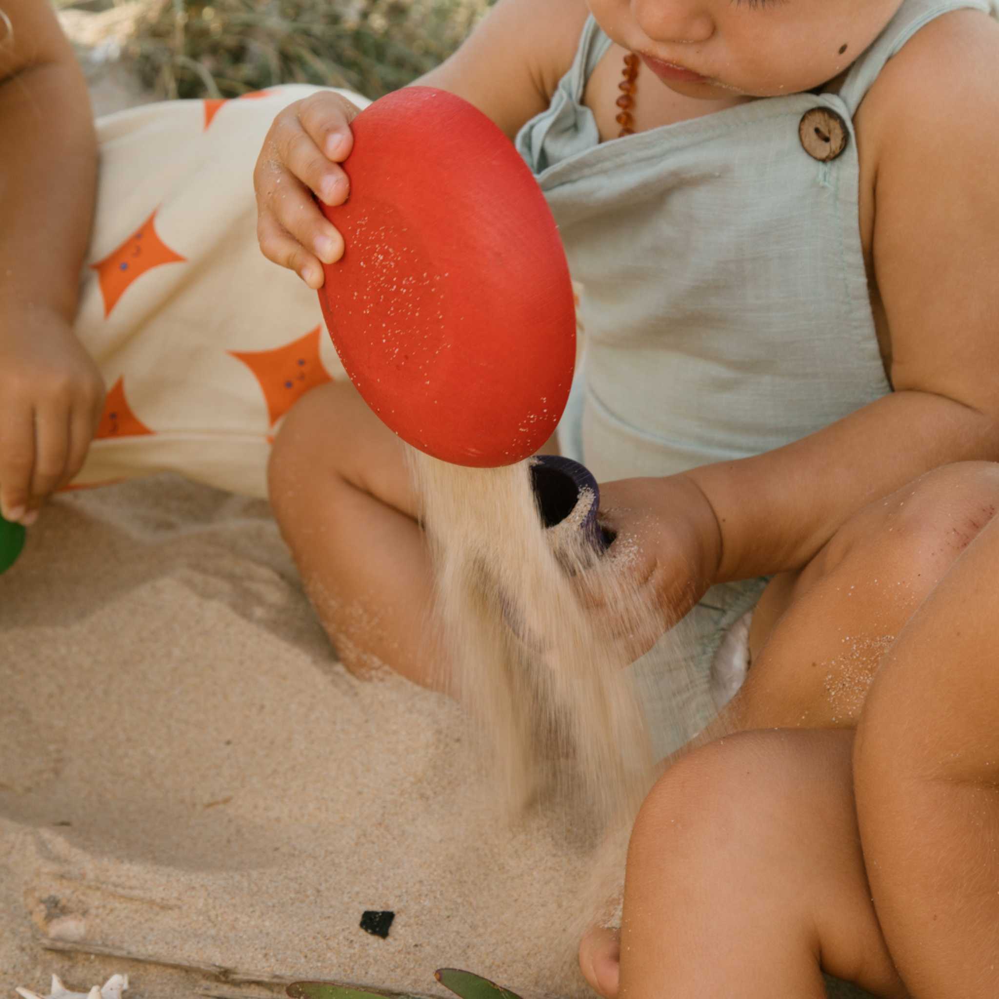 Little One Playing With Grapat Red Pot