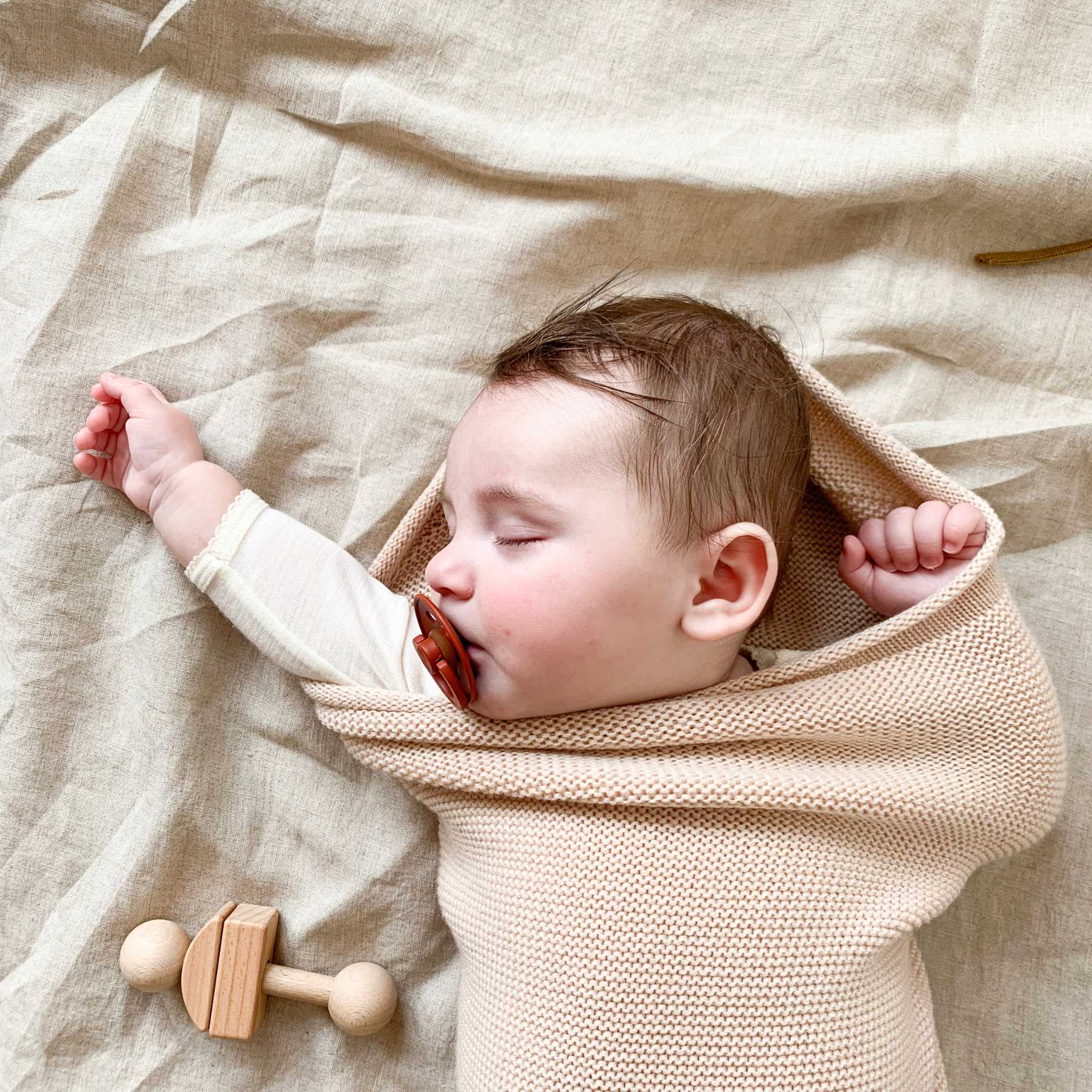 Sleeping Baby In Hvid Merino Wool Cocoon In Oat