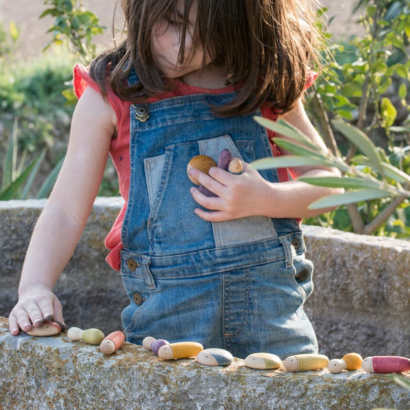 Girl playing with Grapat  Insect Toys on Wall