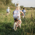 Girl on Little Dutch Balance Bike in Pink