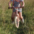 Girl on Little Dutch Balance Bike in Pink