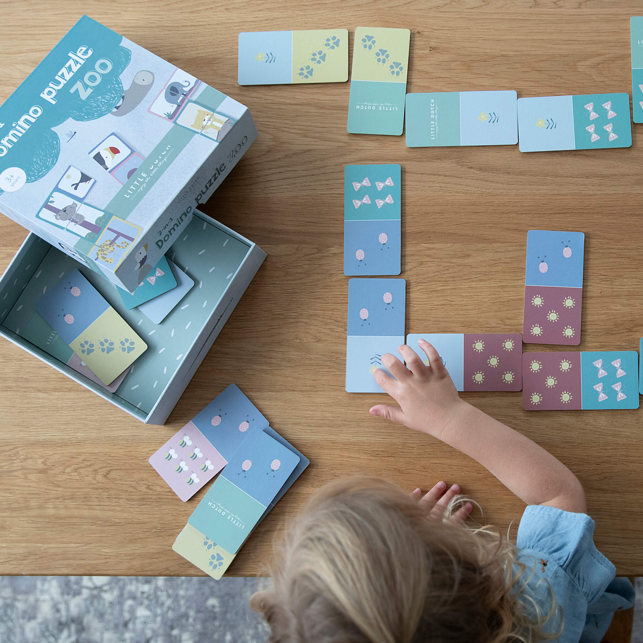 Child Playing Domino Puzzle Game Zoo