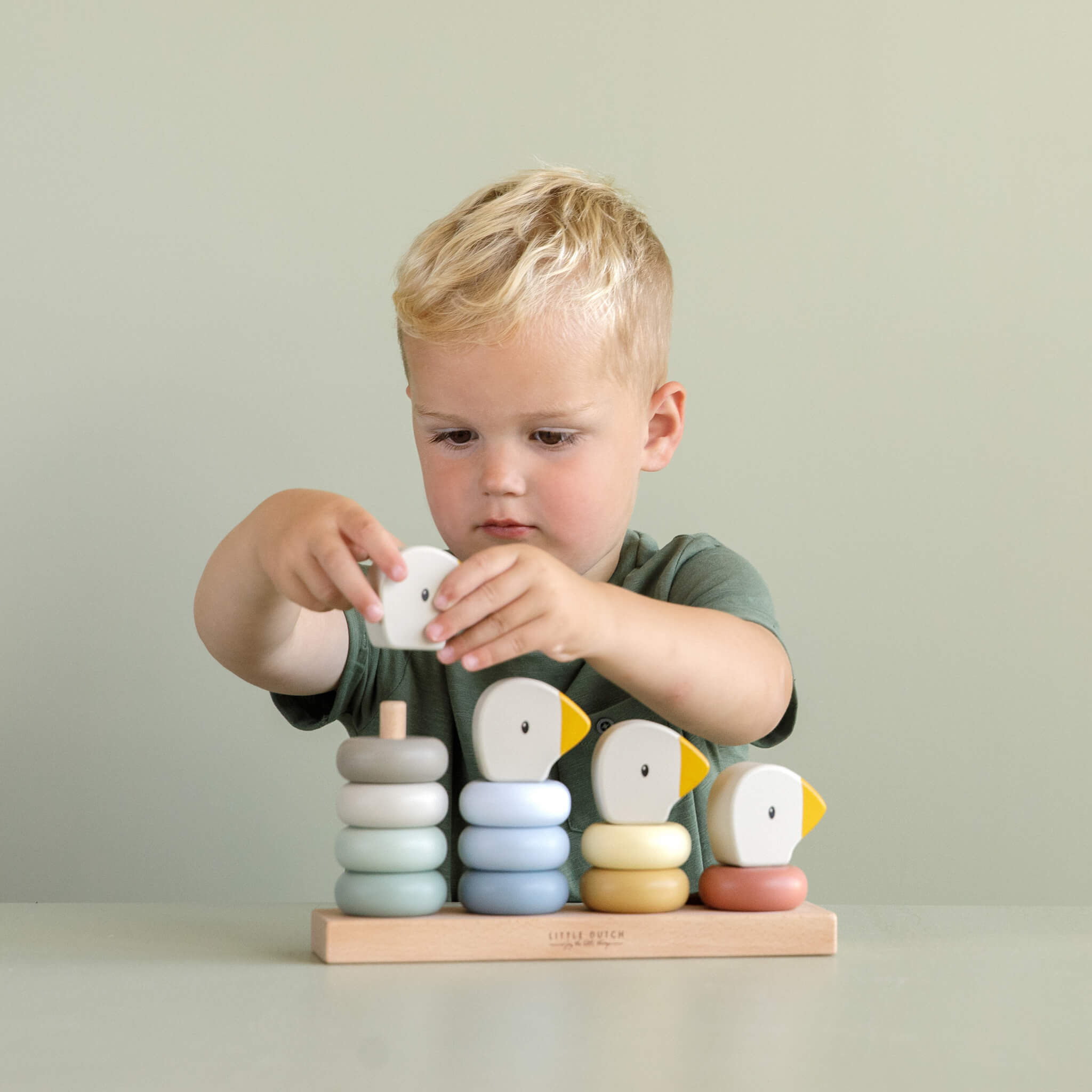Boy Playing with Little Dutch Goose Stacking Family