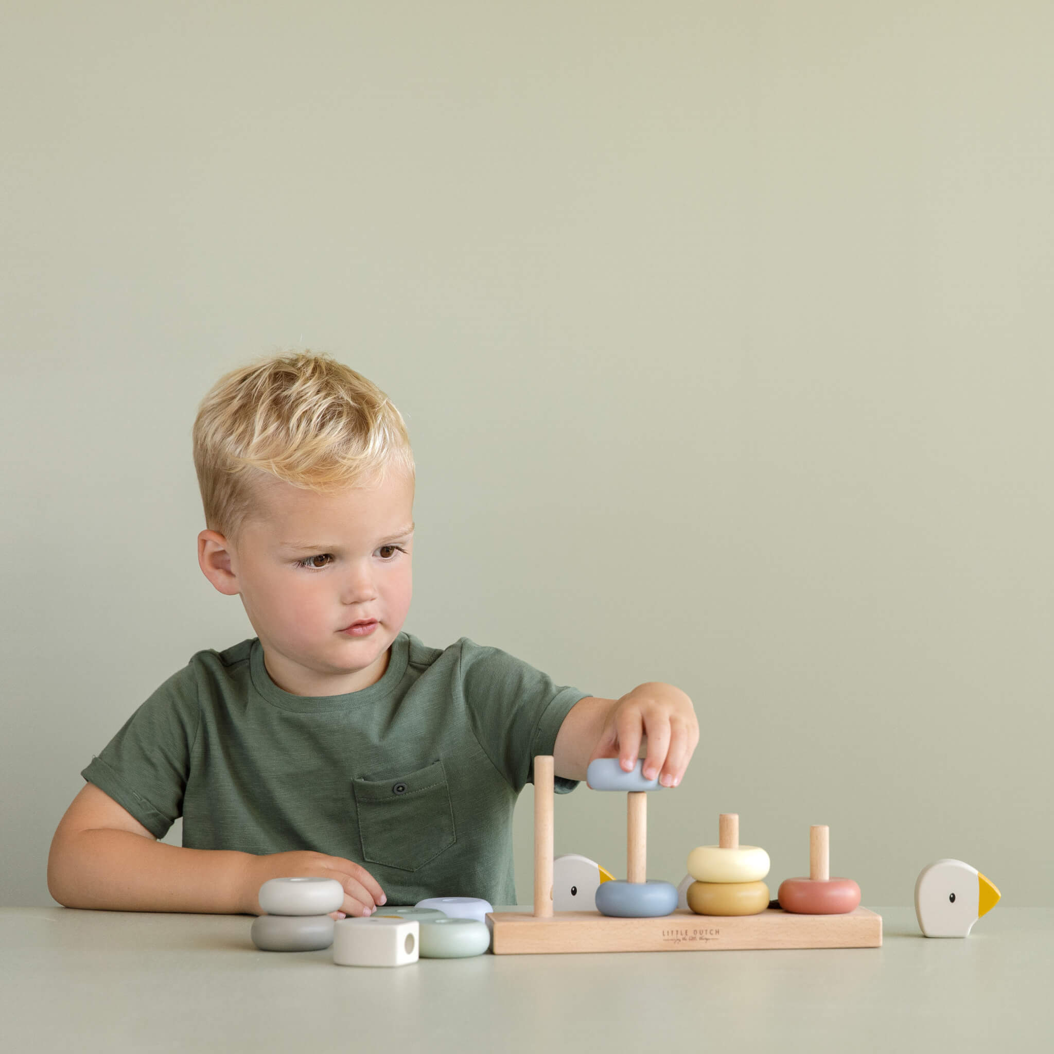 Boy Playing with Little Dutch Goose Stacking Family